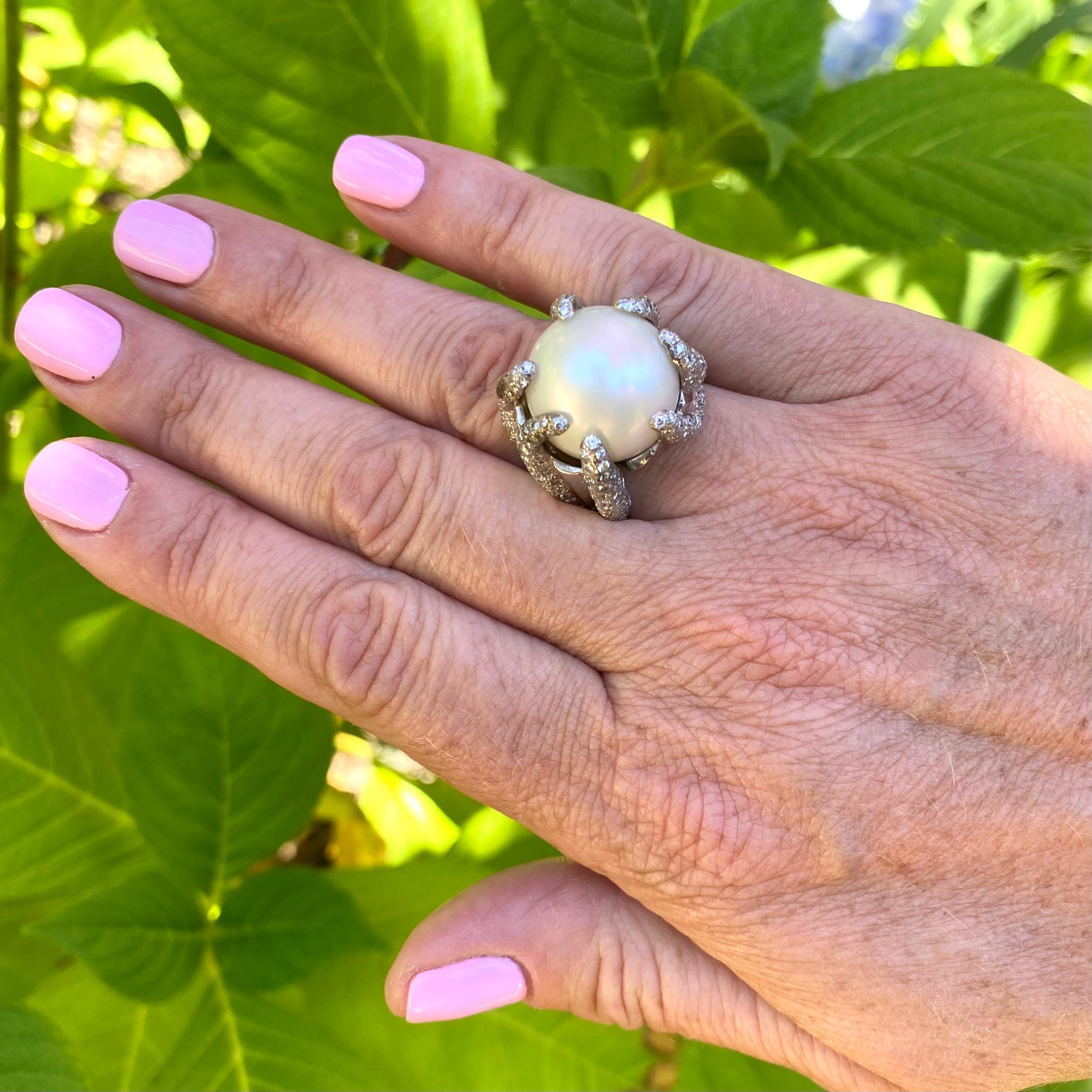 Stunning cocktail ring in 18k white gold & yellow gold features a round 16.8mm south sea pearl artfully designed with claws of brilliant pavé diamonds totaling 3.65 carats.  The height of the ring is 0.75
