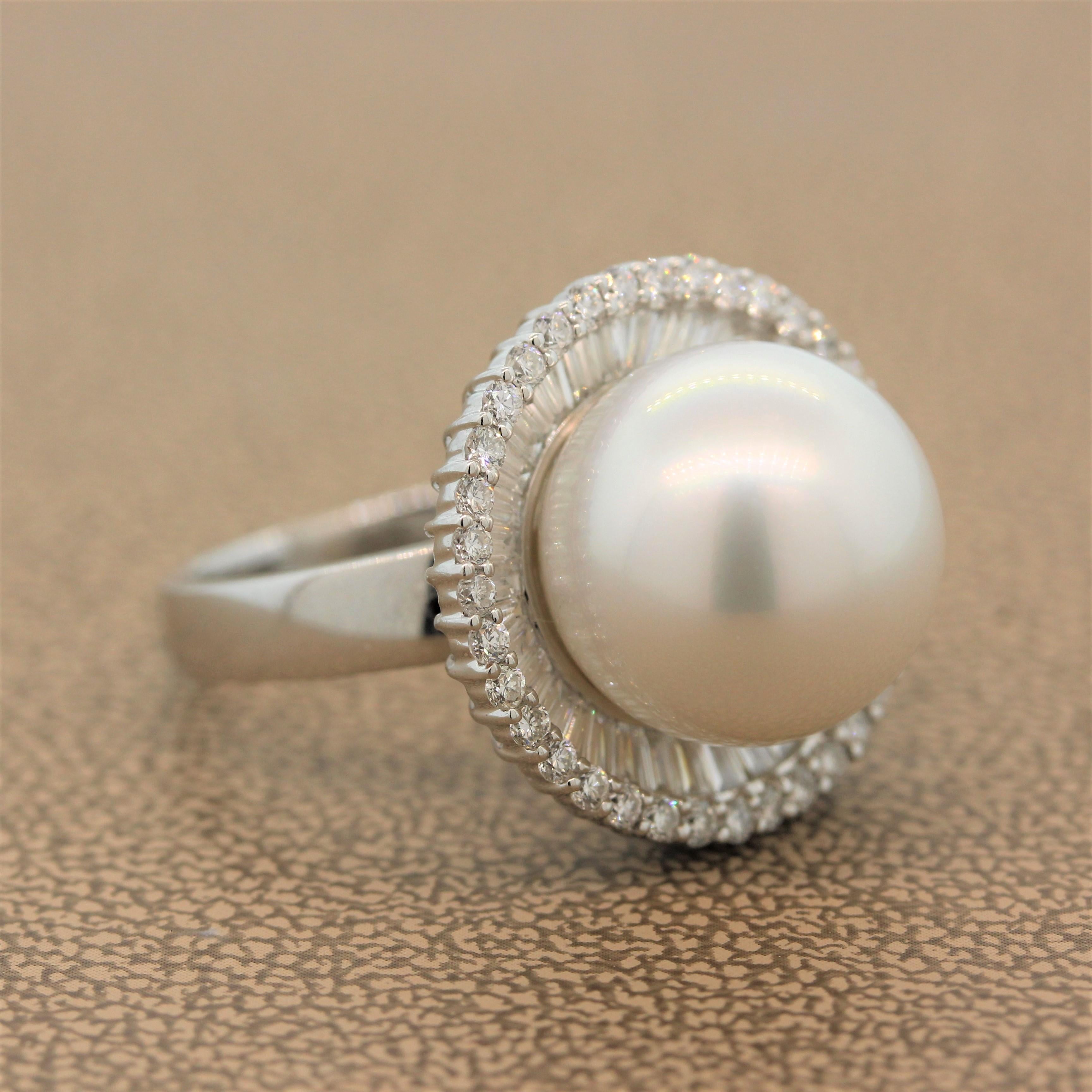 A modern ring featuring a 14.5mm South Sea pearl in a double halo of 1.49 carats of baguette cut diamonds and round cut diamonds. This everyday modest cocktail ring is set in 18K white gold.

Ring Size 6.75 (Sizable)
