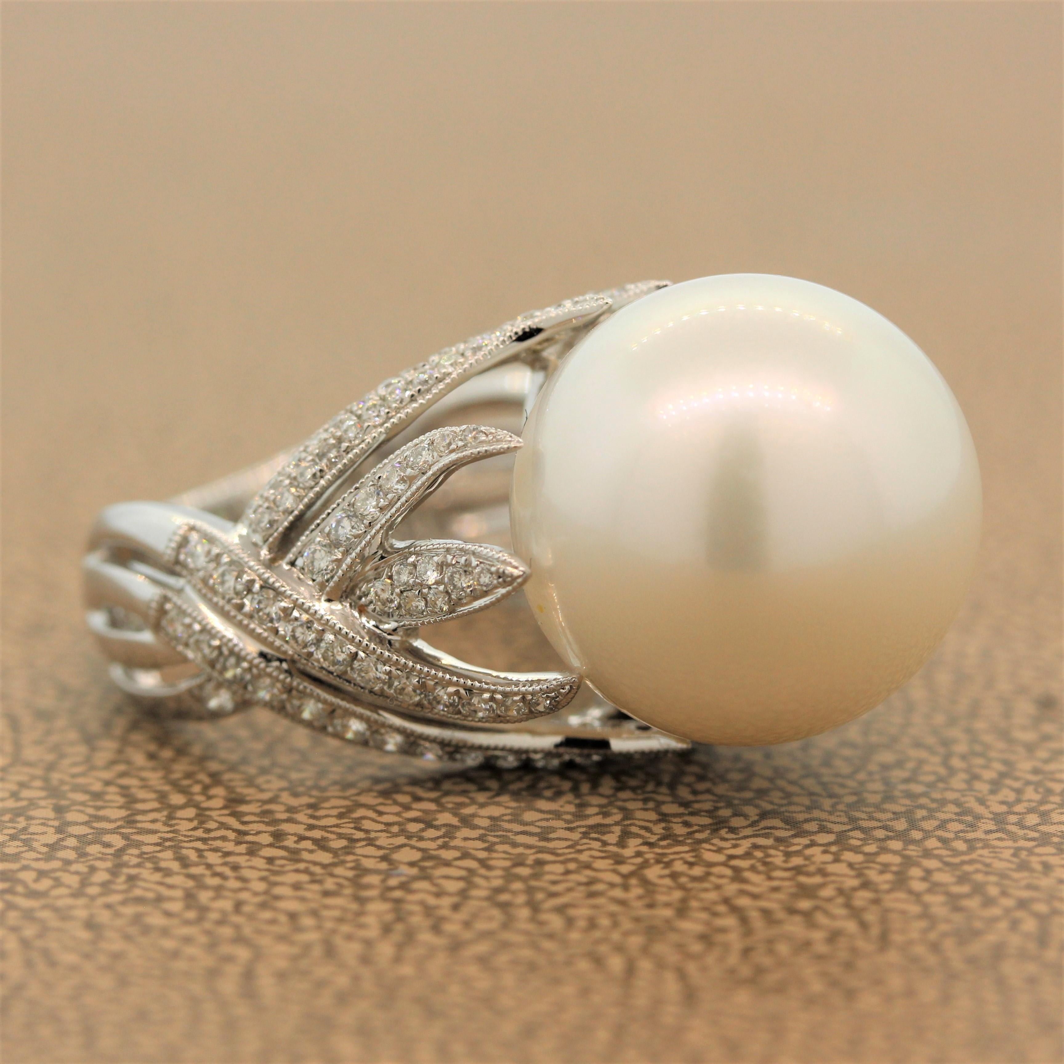 A lustrous 16.5mm South Sea pearl sits high in a flame-like designed setting of 18K white gold. With 0.77 carats of round cut sparkling colorless diamonds, this ring will make you wish you lived under the sea.

Ring Size (Sizable) 6.75
