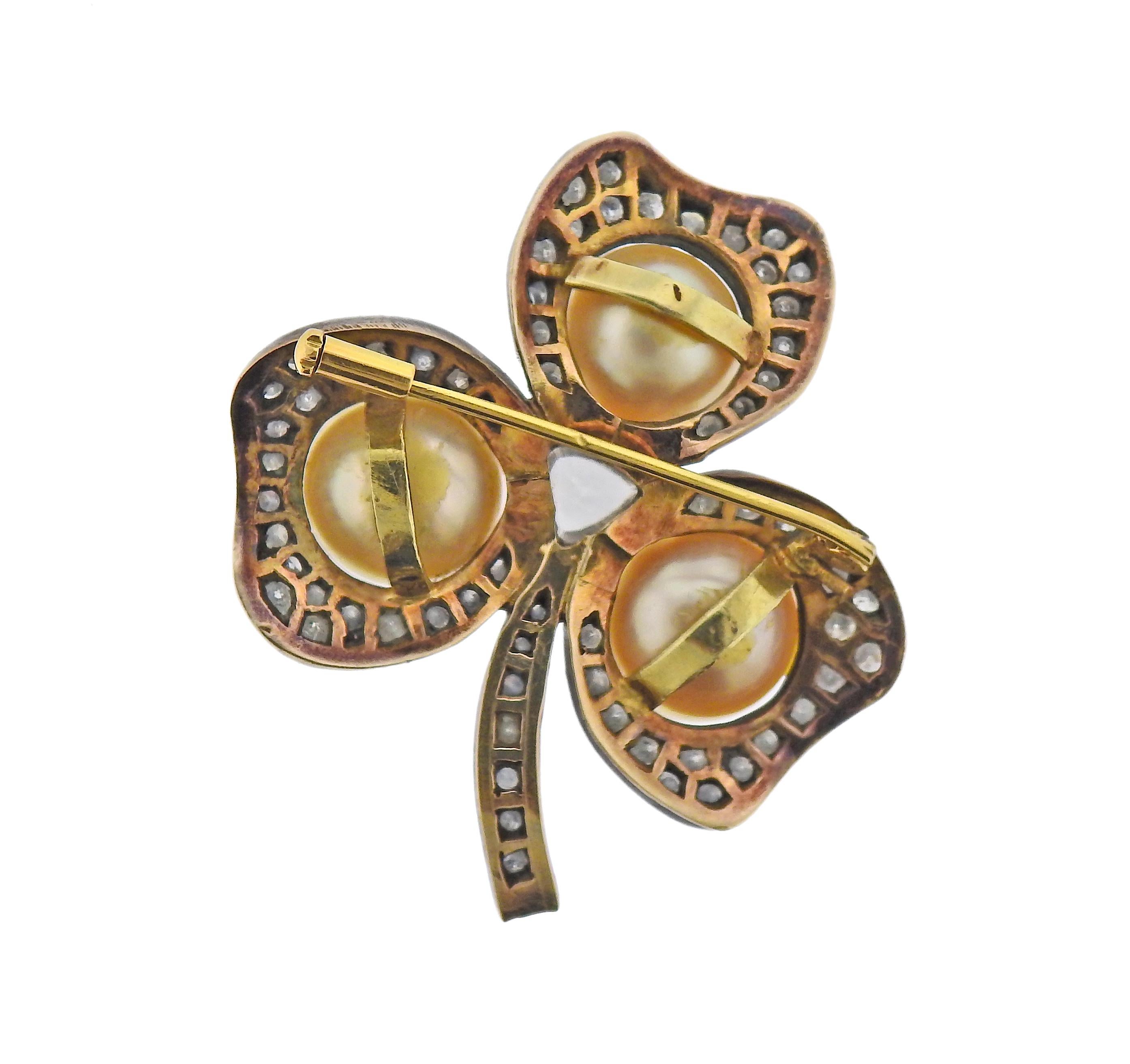 18k gold and silver shamrock brooch, set with three 11.2 - 11.8mm South Sea pearls and approx. 1.80ctw in diamonds. Brooch is 50mm x 45nn. Weight - 20.5 grams. 