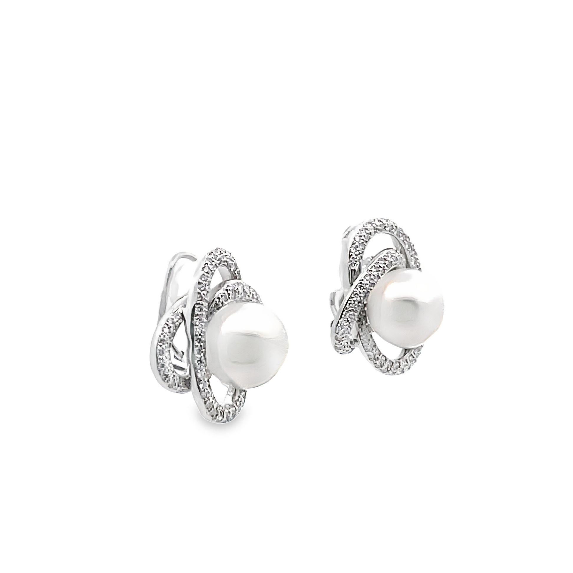 A stylish and classy pair of South Sea pearl earrings. Each pearl measures 12.5 millimeters and are perfectly matching in shape and quality. Perfectly round, free of blemishes and an excellent luster as light rolls across the pearls. They are