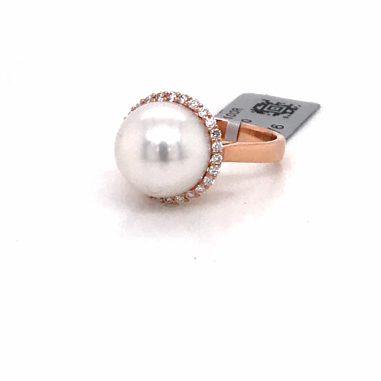 18K Rose gold ring featuring one South Sea Pearl measuring 13-14 mm flanked with 26 round brilliants weighing 0.32 carats.
Color G-H 
Clarity SI

Measurements: 
South Sea Pearl: 12-13 MM
Diamond Halo: 19.8 MM
Height On Finger: 19.7 MM

Ring can be