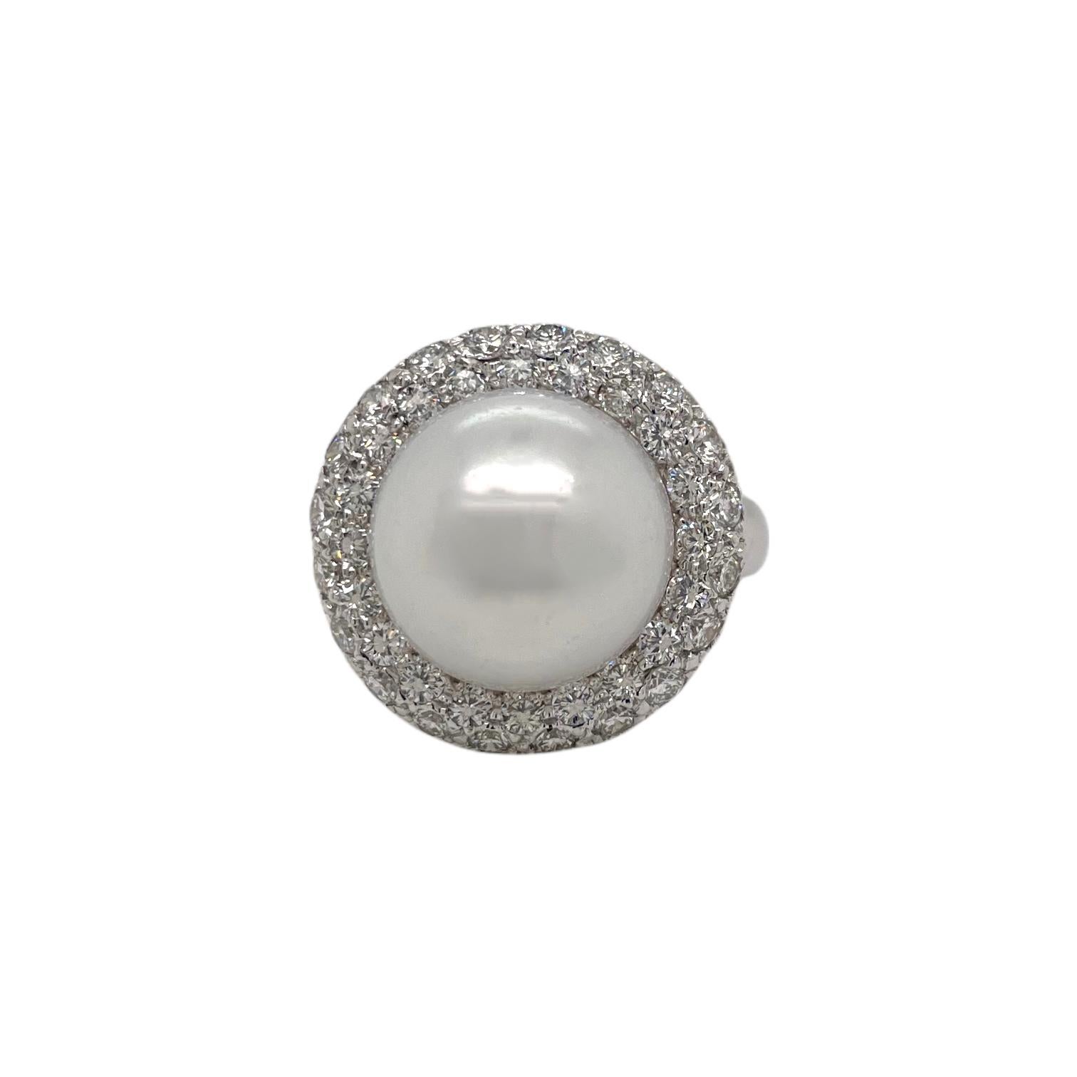 Ring contains one 12.8mm South Sea Pearl and 60 round brilliant diamonds surrounding within a pave style halo, approximately 1.50tcw. Diamonds are near colorless and SI1 in clarity, excellent cut.  

All of our pieces are packaged carefully and