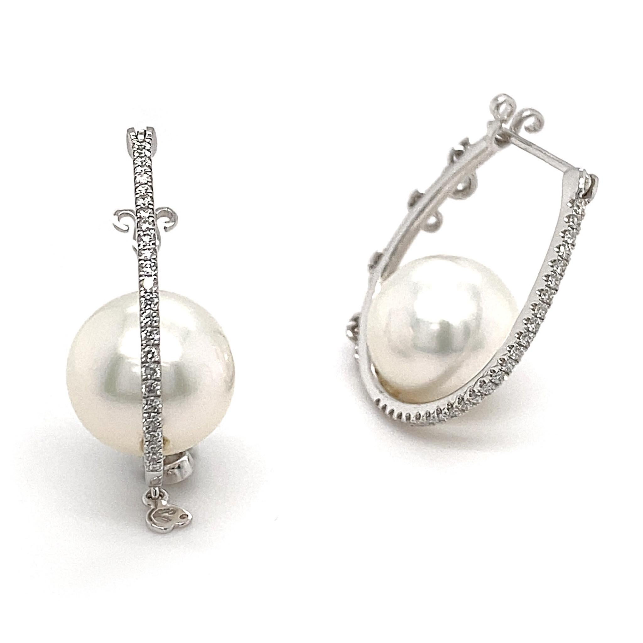 This fun pair of pearl-bijouxed hoops are crafted with the same sophistication as the rest of Dilys’ fine jewellery collection. Anchored by a pair of lustrous South Sea Pearls (totalling 18.70ct; 11.10 x 11.20 + 11 x 11.10mm), these slender