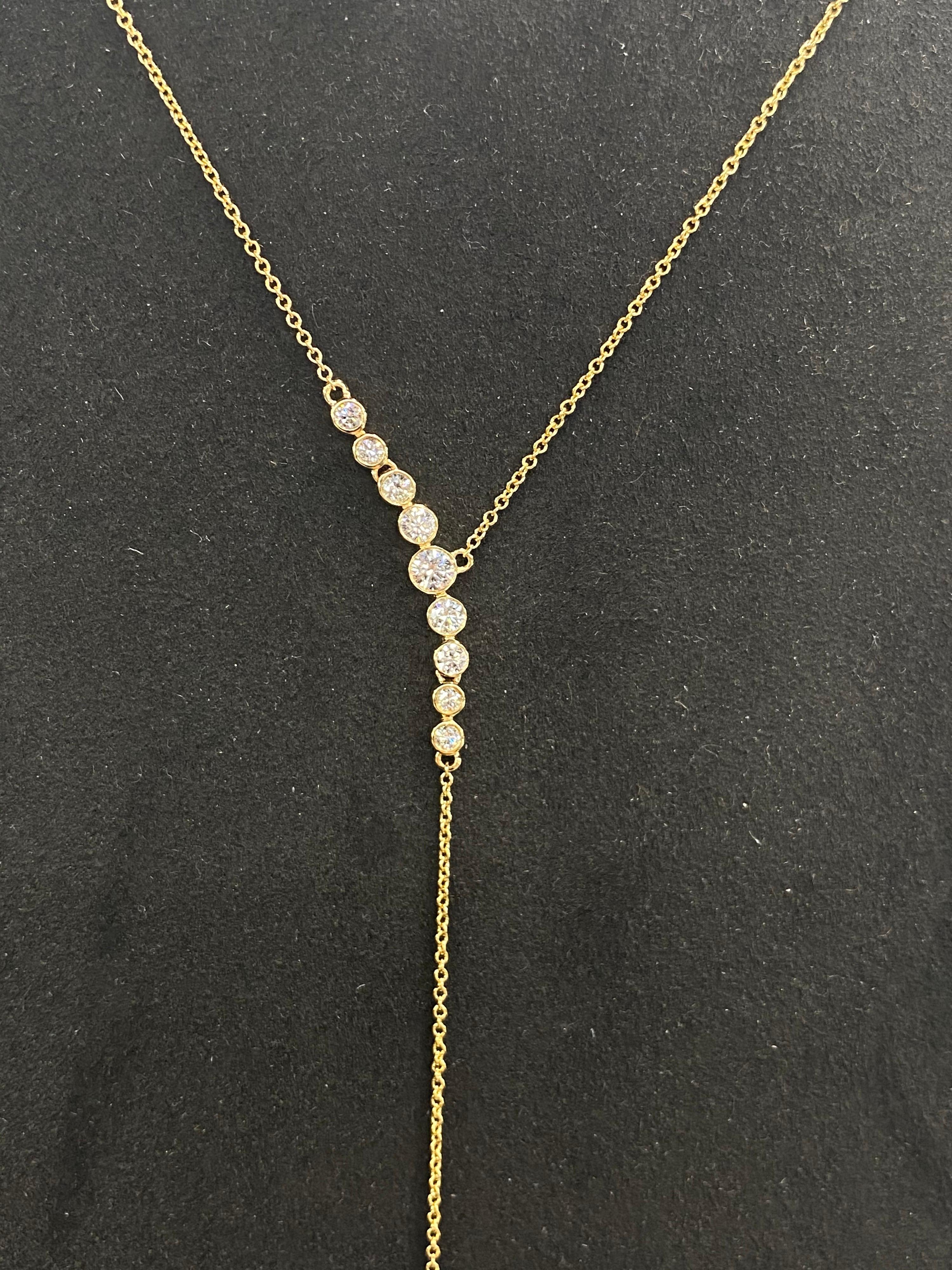 18K Yellow gold lariat necklace featuring 8 round brilliants weighing 0.31 carats with a South Sea Pearl drop measuring 13-14 mm and two round diamonds weighing 0.20 carats.
Color G-H
Clarity SI

Pearl can be changed to a Pink, Golden or Tahitian