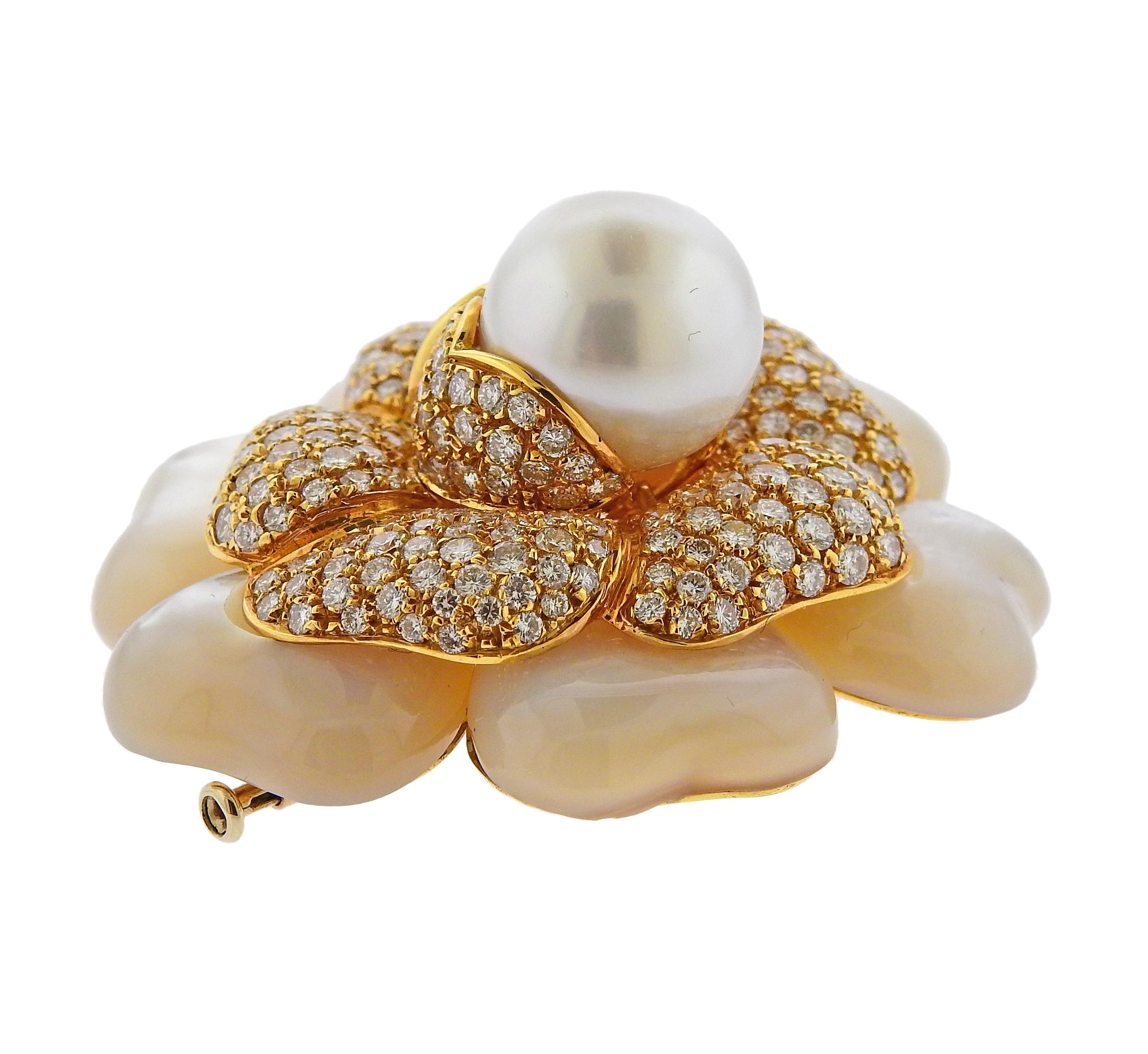 LArge 18k yellow gold flower brooch, set with a 15.5mm South Sea pearl, surrounded with mother of pearl petals and approx. 10.25ctw in diamonds. The brooch is 49mm x 52mm. Marked 750. Weighs 61.9 grams.

SKU#PB-02663