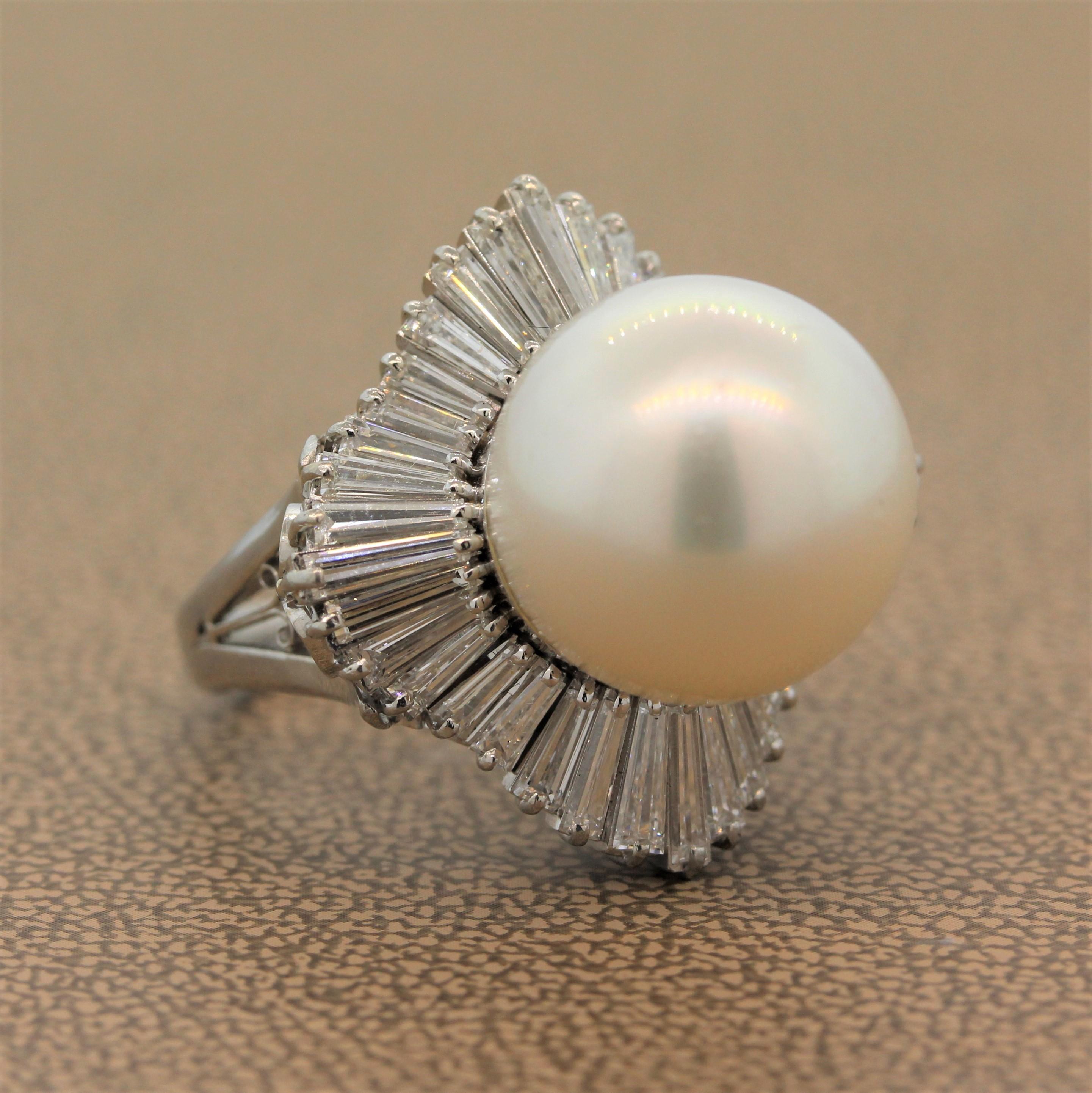 A 14.5mm South Sea pearl takes center stage in this superb estate ring. The platinum setting features fine filigree work encircling the ballerina style halo of this ring with 3.24 carats of VS quality baguette cut diamonds.

Ring Size 6 (Sizable)
