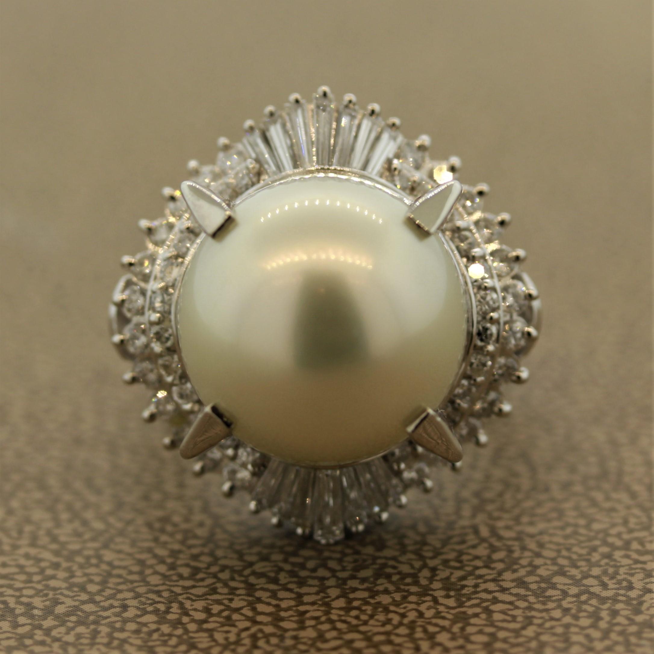 In buying your jewelry you can never go wrong if you go big.

This ring features a stunning 14.4mm South Sea pearl with an amazing luster which is encircled by 1.10 Carats of round and baguette cut diamonds.

The ring is made of platinum.

Ring
