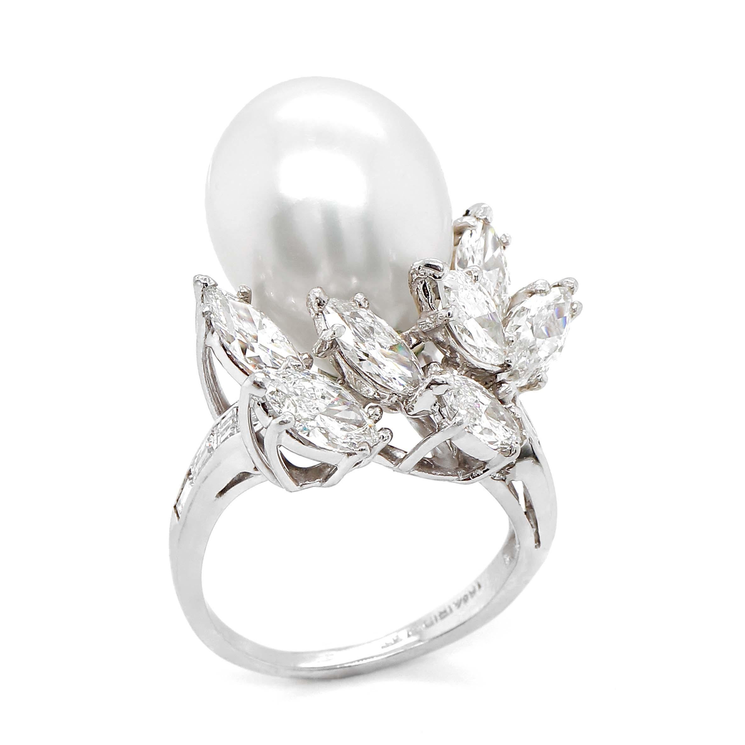 Ring containing one South Sea Pearl measuring 17x13mm, 7 marquise Diamonds of about 2.64 carats 8 baguette Diamonds of about 0.38 carats with a clarity of VS and color G. All stones are set in a platinum ring. The total weight of the ring is