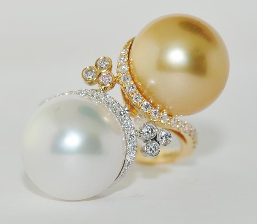 This ring has two 12.50mm south sea pearls surrounded with .33-carats white round diamond set in 18-karat white and yellow gold.

Ring Size 6
