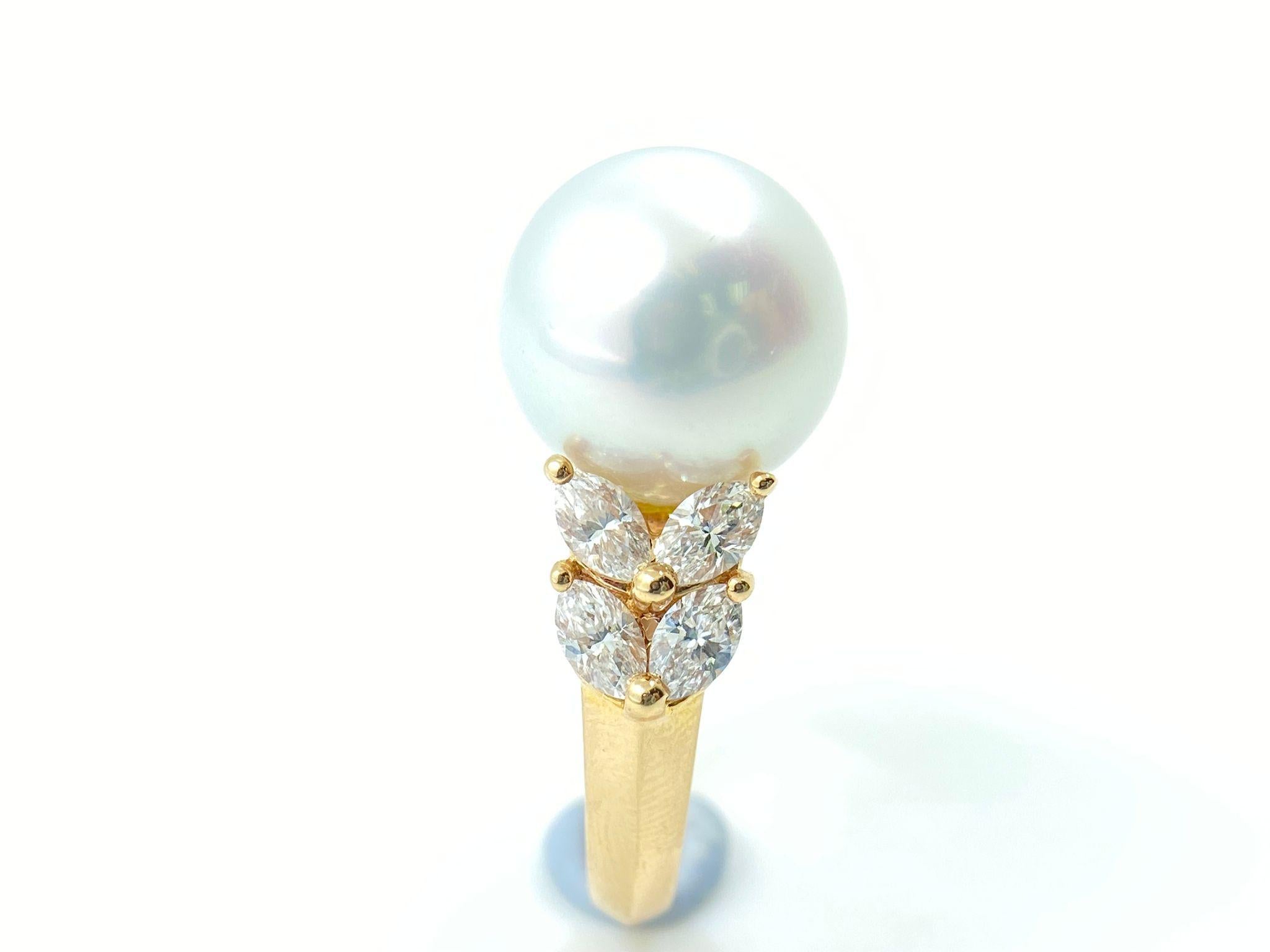 Elevate your elegance with this mesmerizing ring, thoughtfully designed to spotlight a pristine 13mm South Sea white pearl. Its natural luster becomes even more enchanting, thanks to the constellation of 8 marquise diamonds that surround it. These