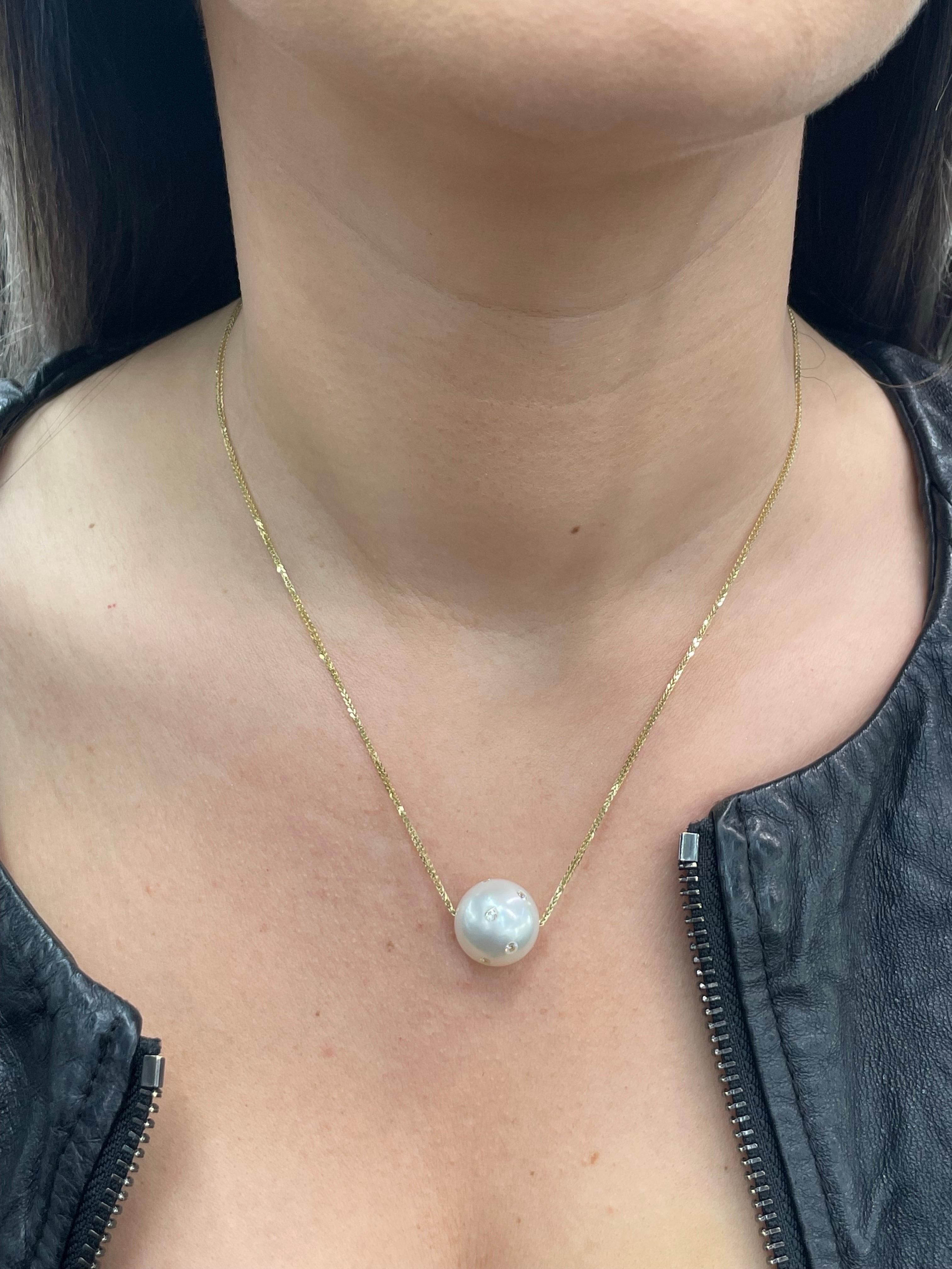 18 Karat Yellow gold slider pendant necklace featuring one South Sea Pearl measuring 15-16 mm with shattered round brilliants weighing 0.25 carats.
Available in different pearls and gold colors. 
DM for more info!