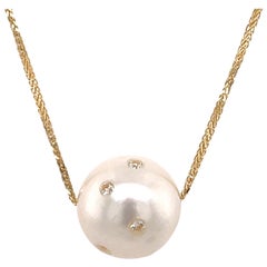 Ciondolo con perla dei mari del sud e diamante da 0,25 carati 15-16 mm in oro giallo 18 carati