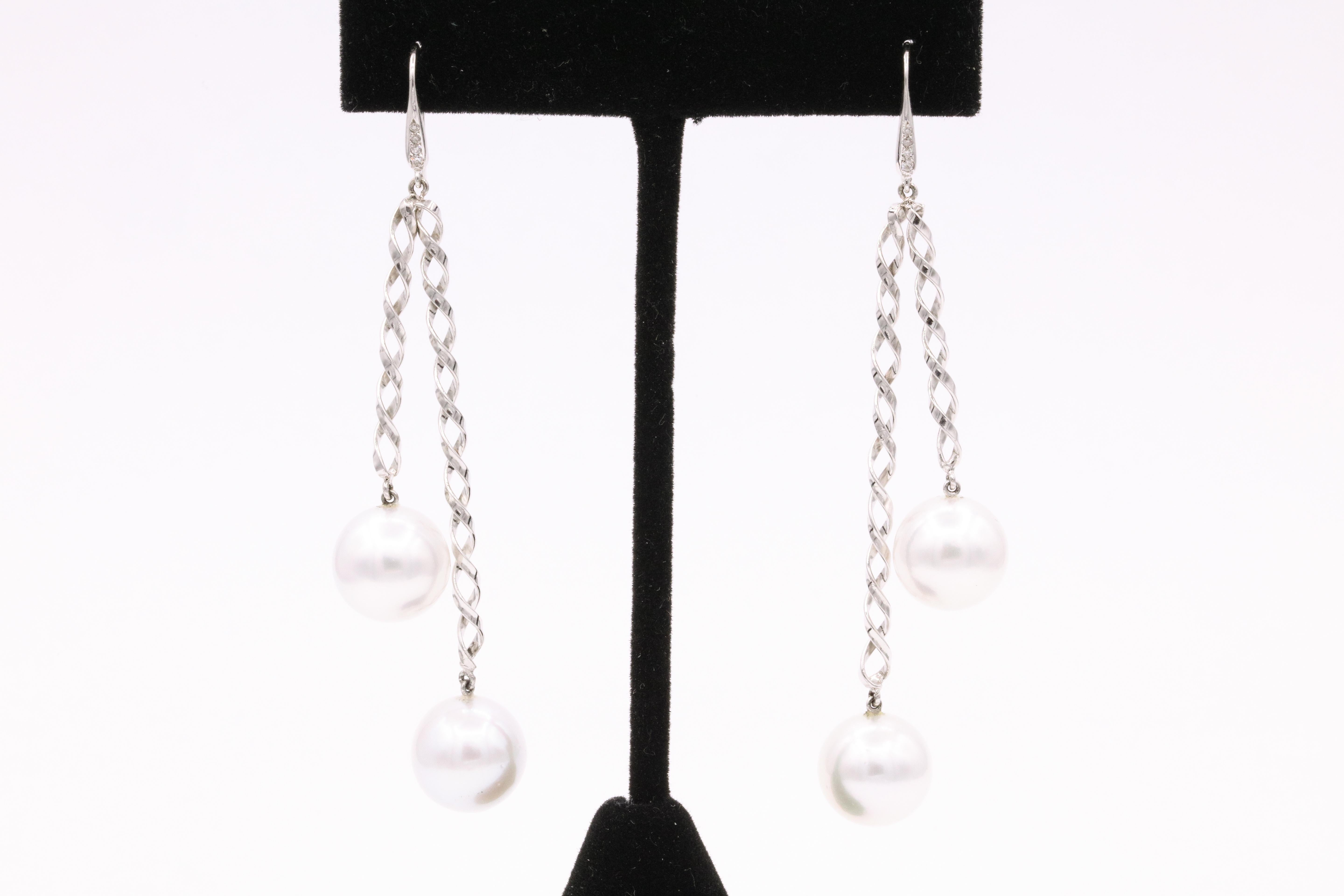 Contemporary South Sea Pearl Diamond Swirl Drop Earrings 0.10 Carats 14 Karat White Gold For Sale