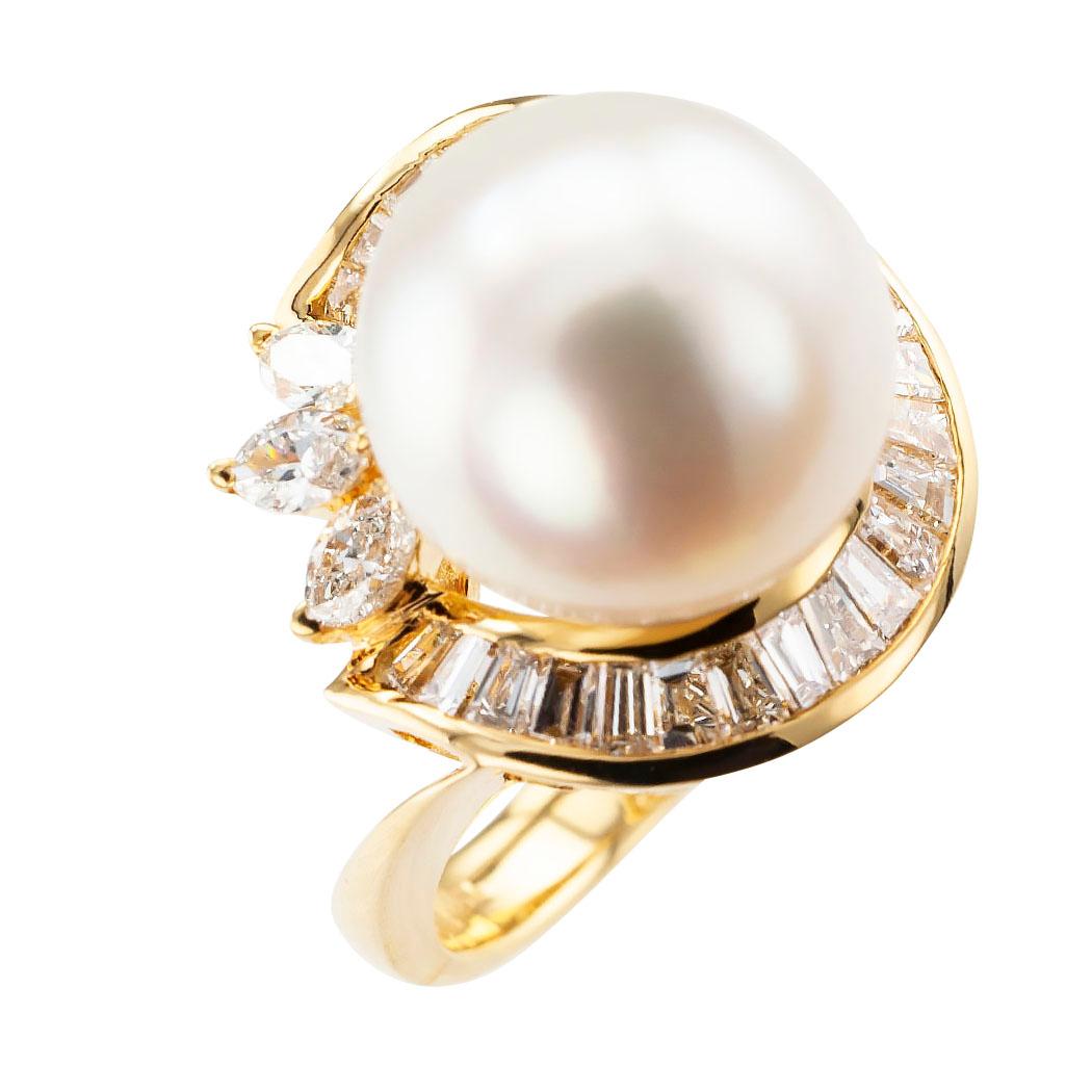 South Sea pearl diamond and gold cocktail ring circa 1990.

DETAILS:
GEMSTONES:  one South Sea pearl measuring approximately 12 mm.
DIAMONDS:  twenty-eight baguette and marquise-shaped diamonds totaling approximately 1.25 carats, approximately G – H