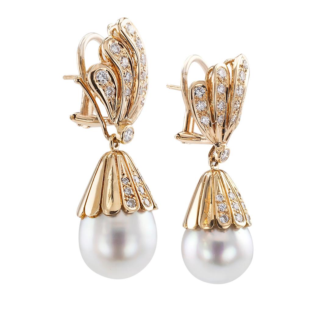 South Sea pearl diamond and yellow gold day into night drop earrings circa 1980.

DETAILS:

PEARLS:  two creamy white with silver undertones South Sea pearls measuring approximately 12 mm.

DIAMONDS:  sixty round brilliant-cut diamonds totaling