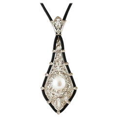 South Sea Pearl, Diamonds, White Gold Pendant and Black Neck Cord South Sea Pearl, Diamonds, White Gold Pendant and Black Neck Cord