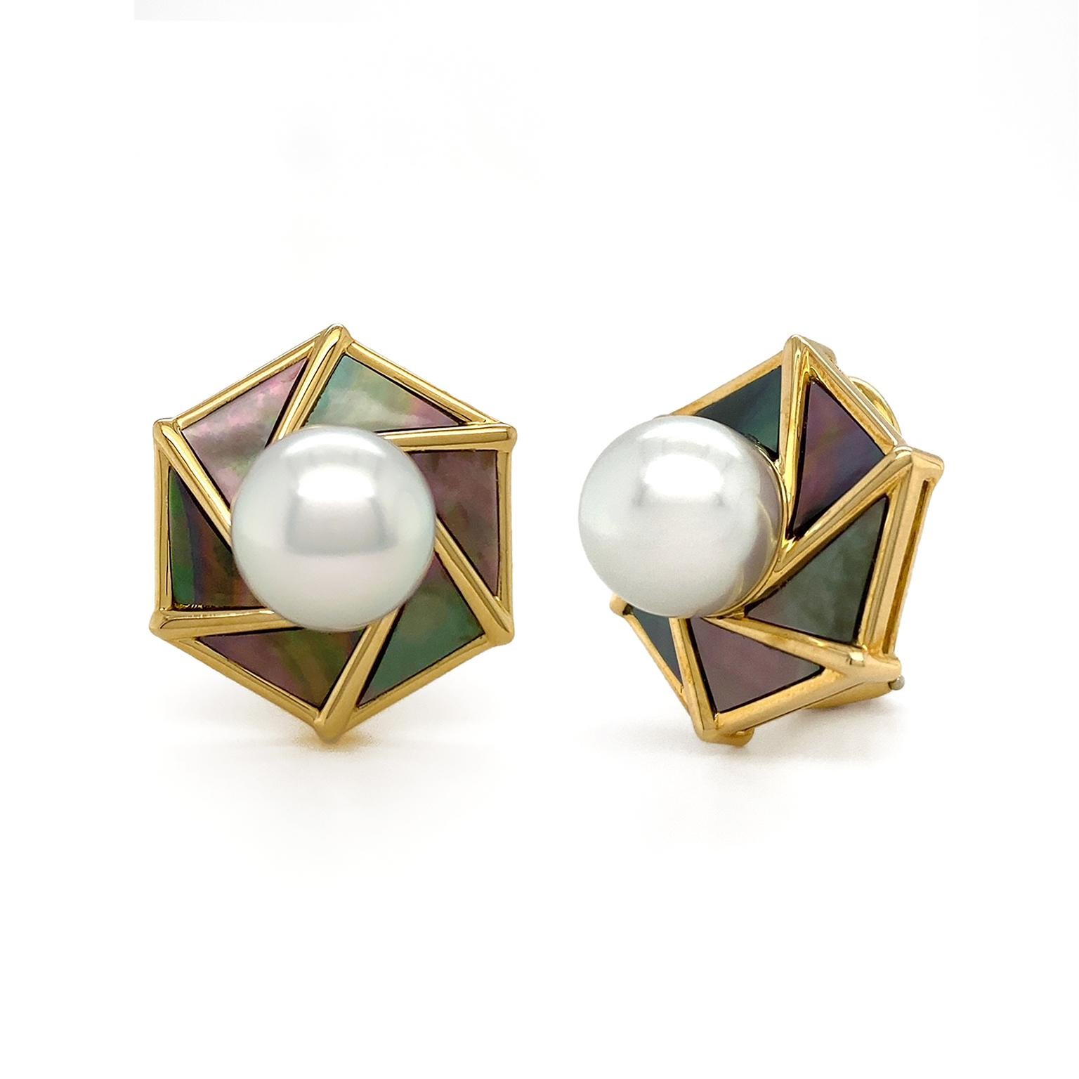 The opalescent sheen of pearls is showcased in these earrings. Mother of pearl is the foundation, which features multicolor over the black hue. 18k yellow gold borders the pearl and slender beams extended to rotate around a south sea pearl in the
