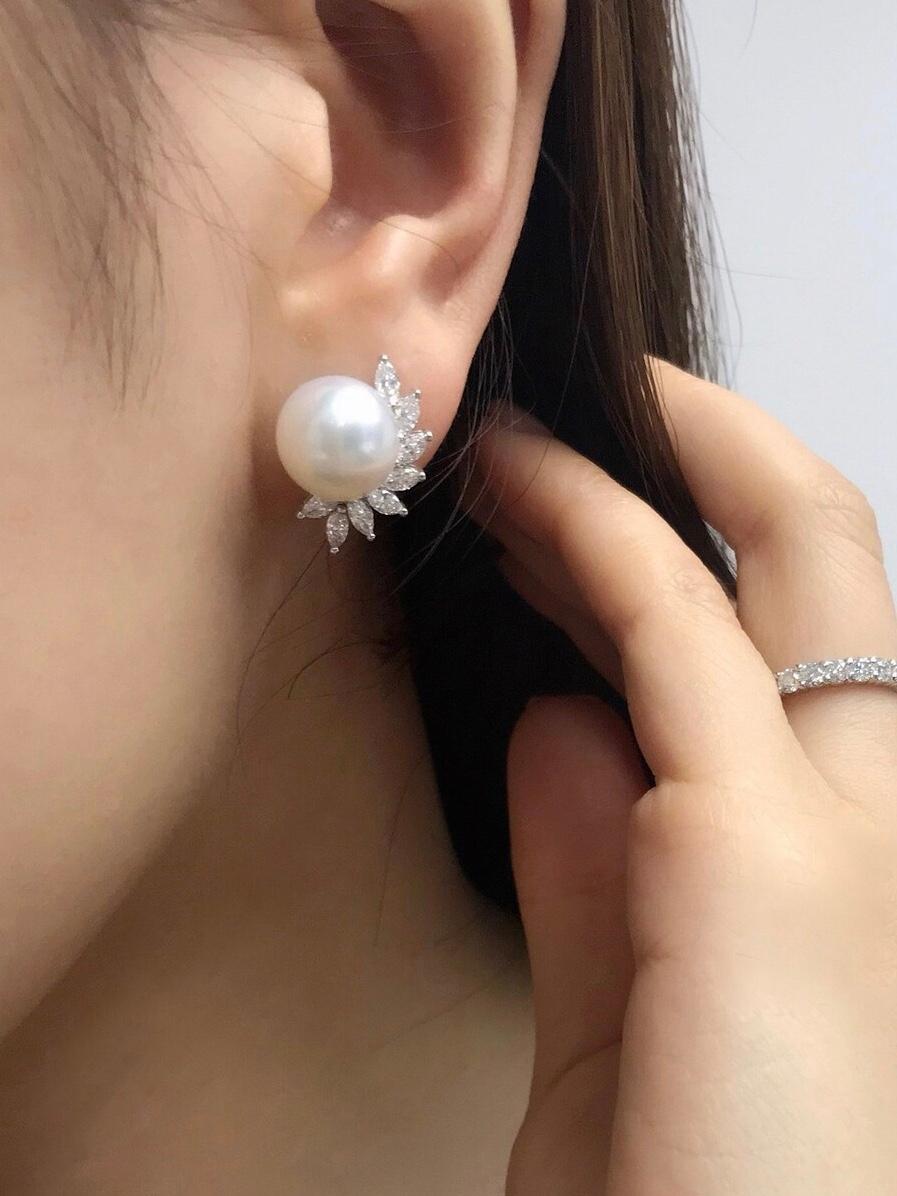 This handmade earrings will be a great everyday jewelry, or elegant wedding earrings.

Product Specifications:
- 16 Marquise Shaped Diamonds with 0.96ct
- Two 10.81mm to 10.83mm South Sea Pearl
Quality: D-F in Color and VS in Clarity
- 18K White