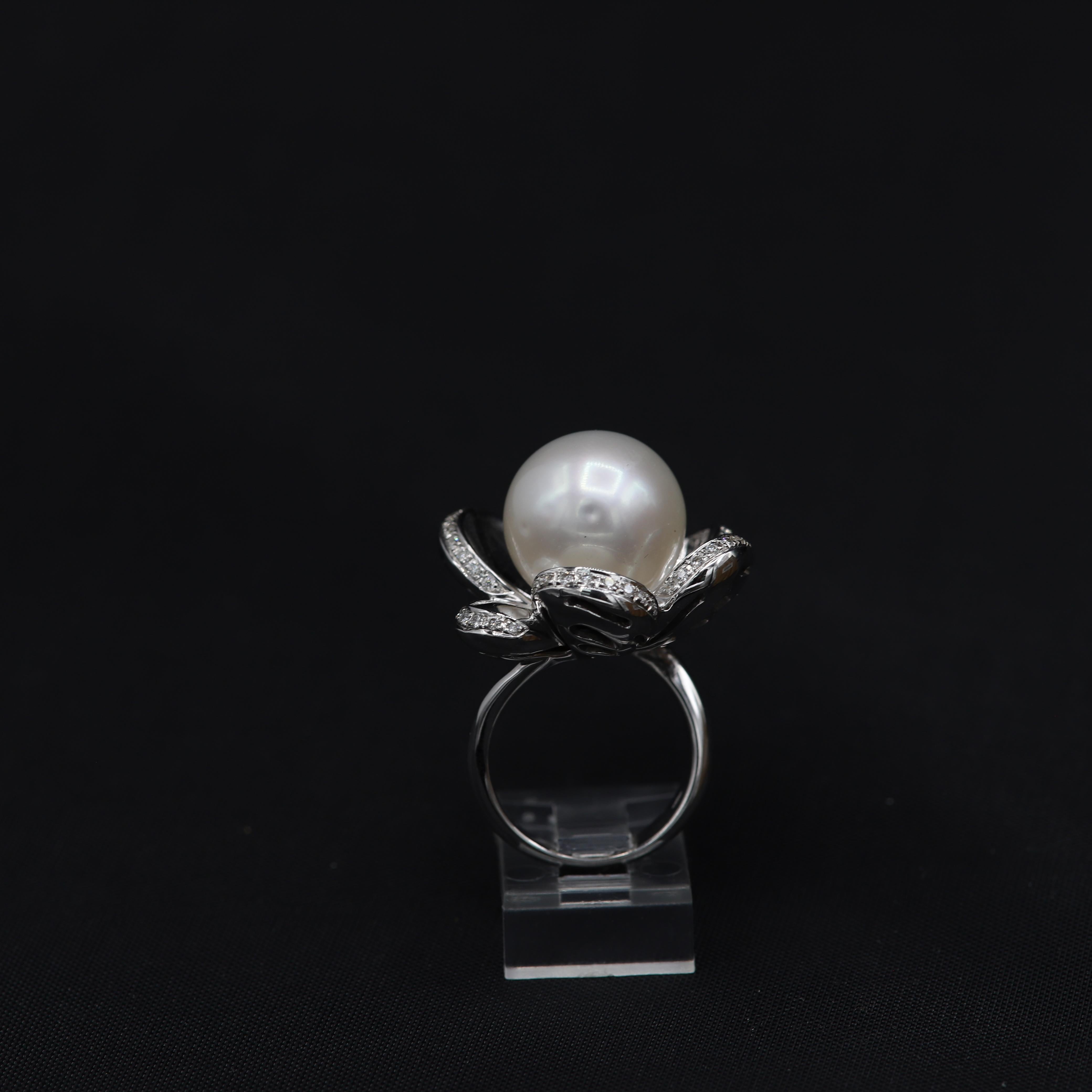 Large South Sea Pearl Flower Ring
Large 15 mm
18k White Gold  25 grams
Diamonds 0.48 carat G-VS
overall design area approx 25mm
Good Nice Luster Pearl
Finger Size 7

