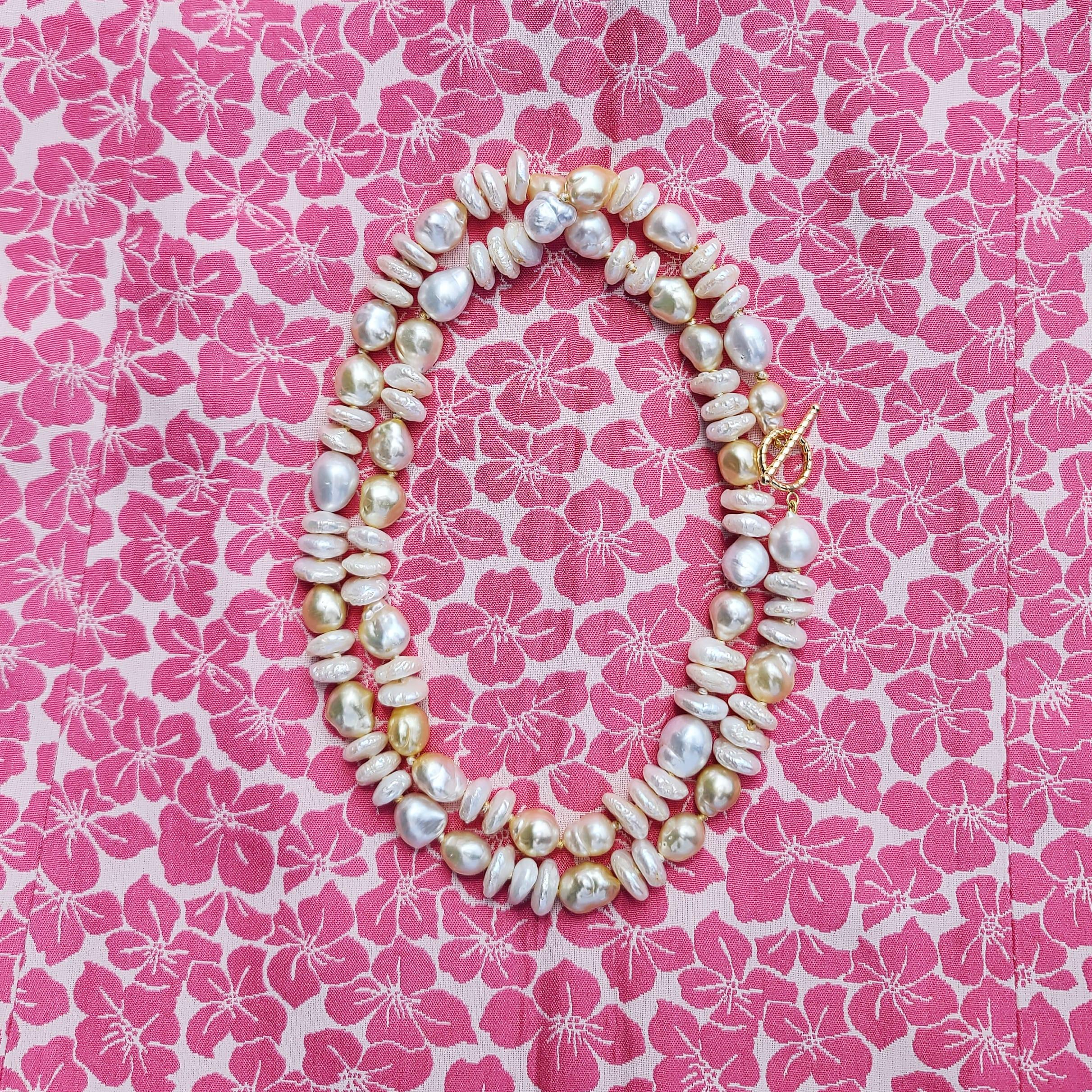 Yellow to Golden South Sea Pearls & Silvery White South Sea Pearls, collide with creamy oblong shaped Fresh Water Pearls in a beautiful balance of texture for a unique spin on the classic pearl necklace. Each Pearl is hand-knotted on gold color silk