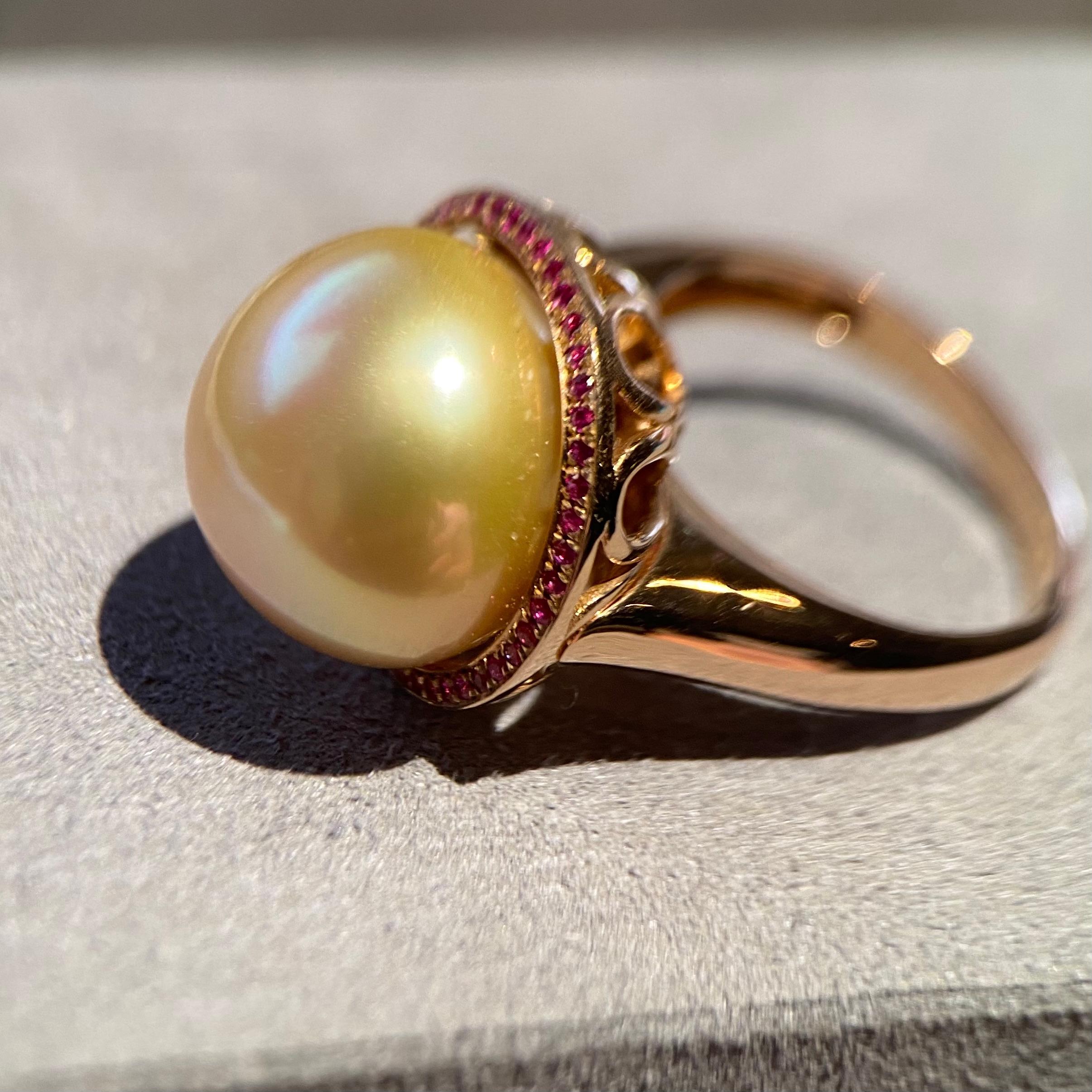 This is a Golden South Sea Pearl and Ruby Pendant Ring in 18K Rose Gold. The idea behind this piece is to bring out the passionate and fiery characteristic of the owner. The use of 18K Rose Gold really elevated the combination of Deep Golden colour