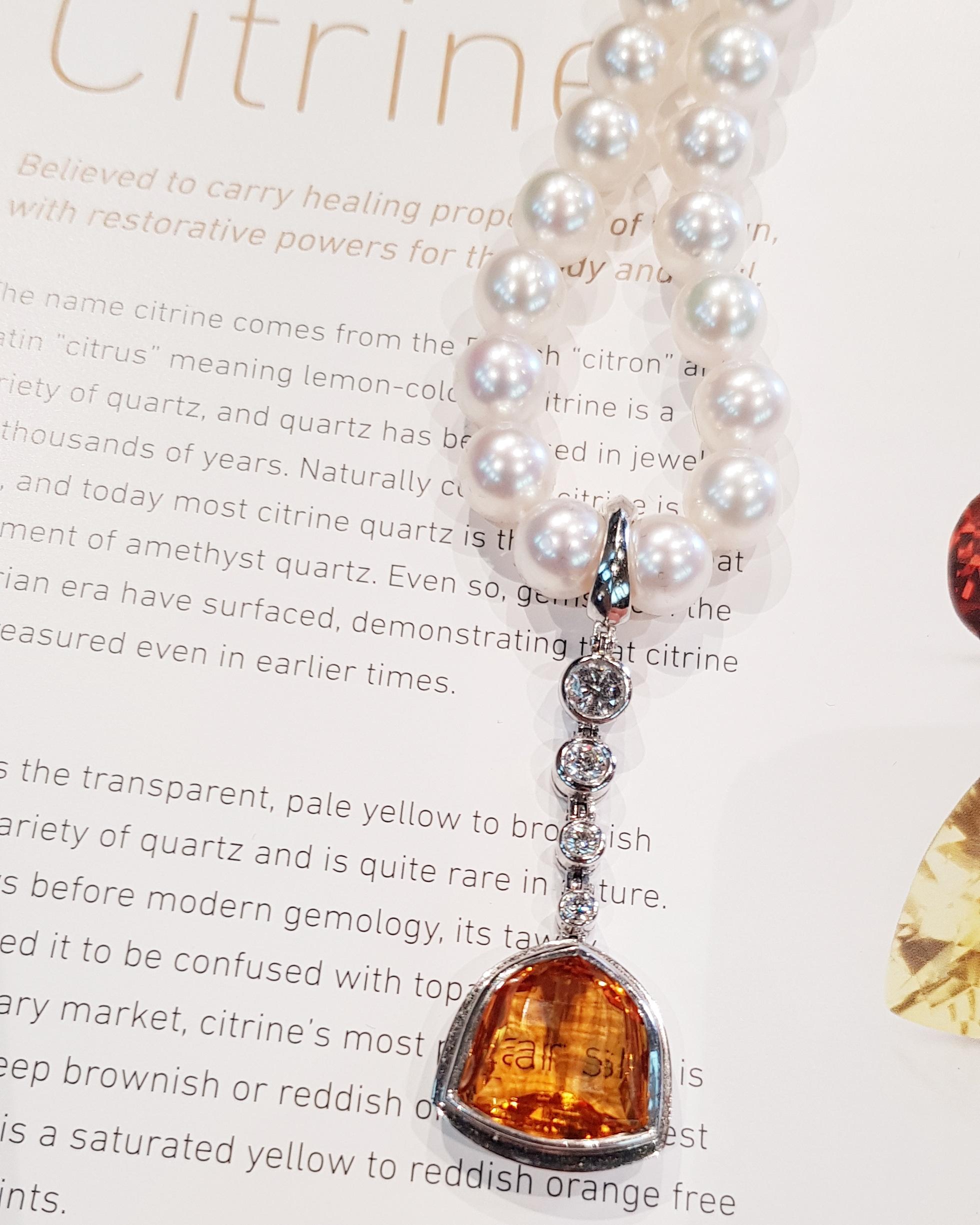 Elegant Pearl strand with 8.8mm perfectly round AAA grade white South Sea Pearls and an 18ct white gold matte finish clasp ;suspending a gorgeous clip on trillion cut Palm Citrine pearl enhancer. 
A pearl strand represents an unequivocal statement