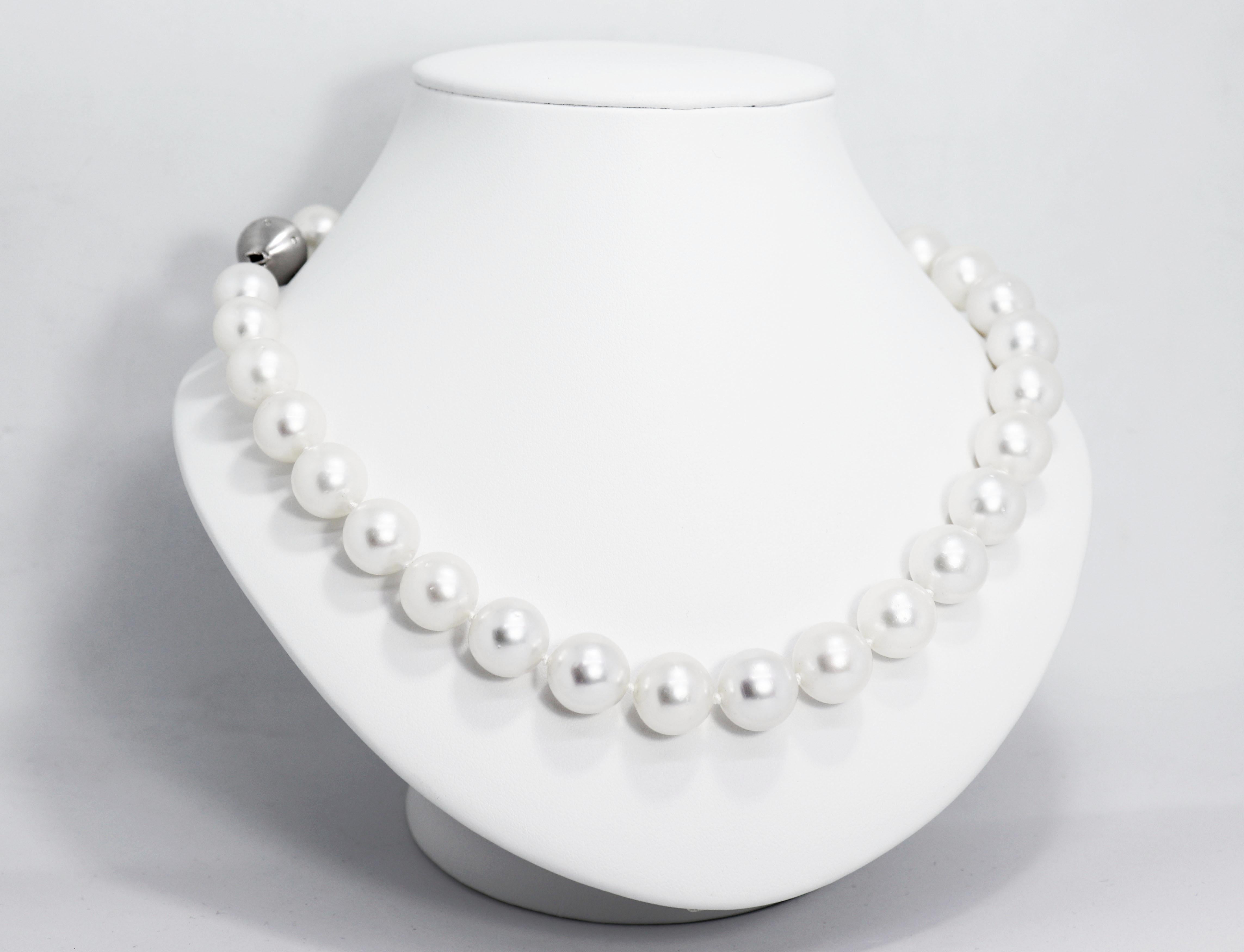 Beautiful necklace featuring 31 cultured white South Sea pearls graduating from 13.9mm - 12mm in diameter finished with an 18 carat white gold matte finish clap set with 12 round brilliant cut diamonds weighing approximately 0.18ct. The necklace