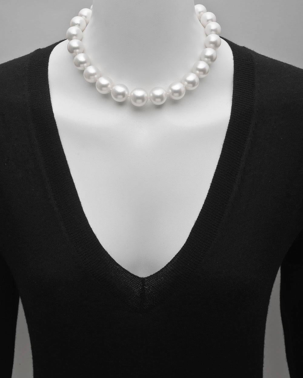 South Sea pearl necklace, composed of 25 slightly graduated South Sea cultured pearls with diameters ranging from 17.4mm to 15mm, strung on a hand-knotted silk cord, with an 'invisible' screw clasp linking the two pearls at back. 16
