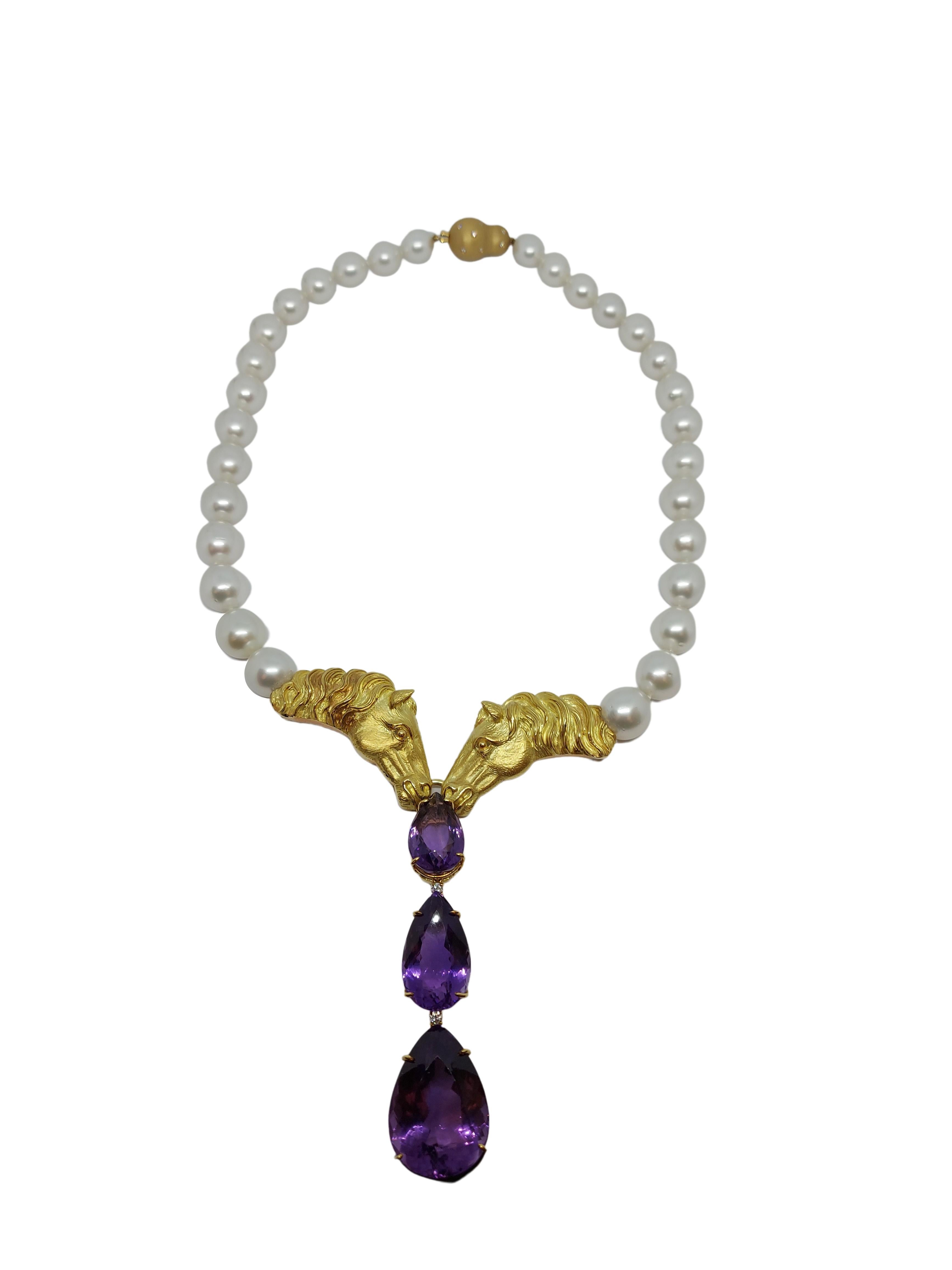 Amazing South Sea Pearl Necklace & Precision Hand Crafted 18kt Gold Horse Heads and Semi Precious Pear Shape stones .

Necklace can be made shorter by taking off Pear Shape Amethyst stones.

Only 1 made World Wide !

Amethyst: Three large amethysts,