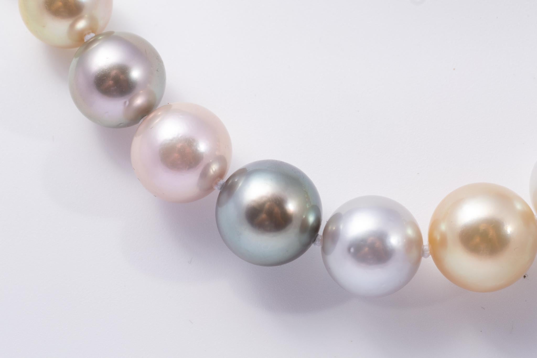 Rare and spectacular multi color strand of cultured south sea pearls. There are 32 pearls that range in size from 15.00mm to 13.00mm. The colors are peacock green, pistachio green, golden, pink and white. All of the pearls are round with smooth