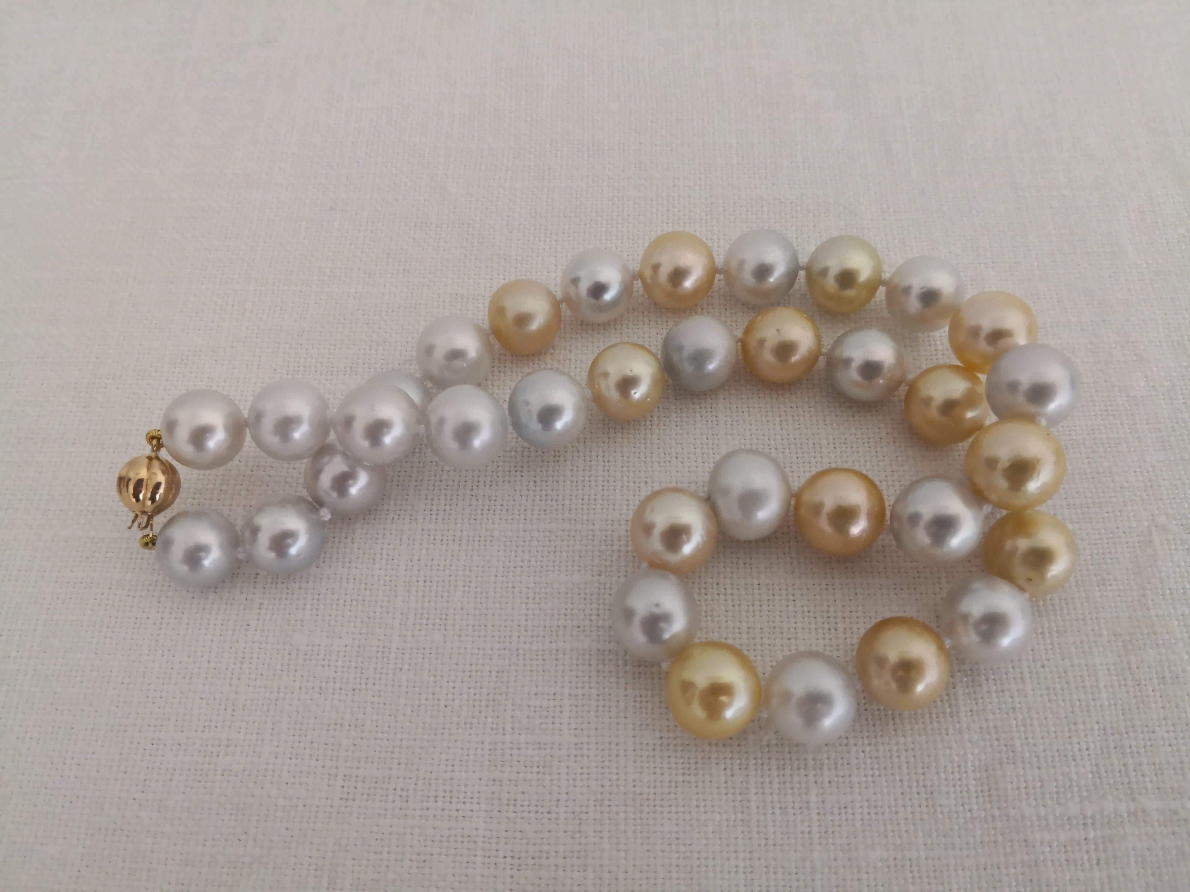 A Natural Color South Sea Pearls necklace

- Size of Pearls 11-12 mm of diameter.

- Pearls from Pinctada Maxima Oyster

- Origin: Indonesia ocean waters

- Natural Color Gold and Light Silver pearls

- High Natural luster and orient

- Pearls of