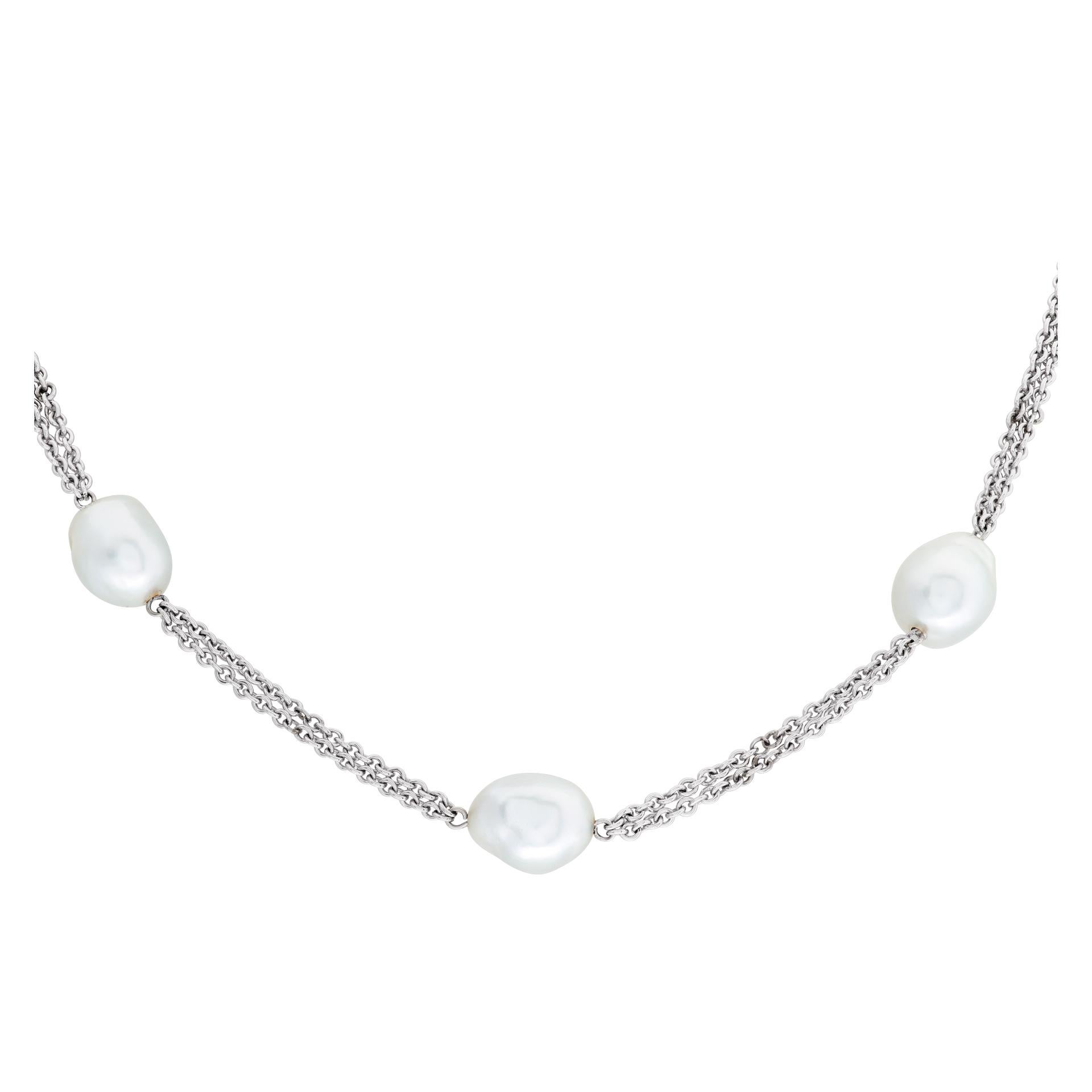 Luxurious 18k white gold necklace, with rare South Sea pearls measuring 10mm x 13mm, and with soft silver tone, on a 18k white gold chain with a lobster clasp. 15