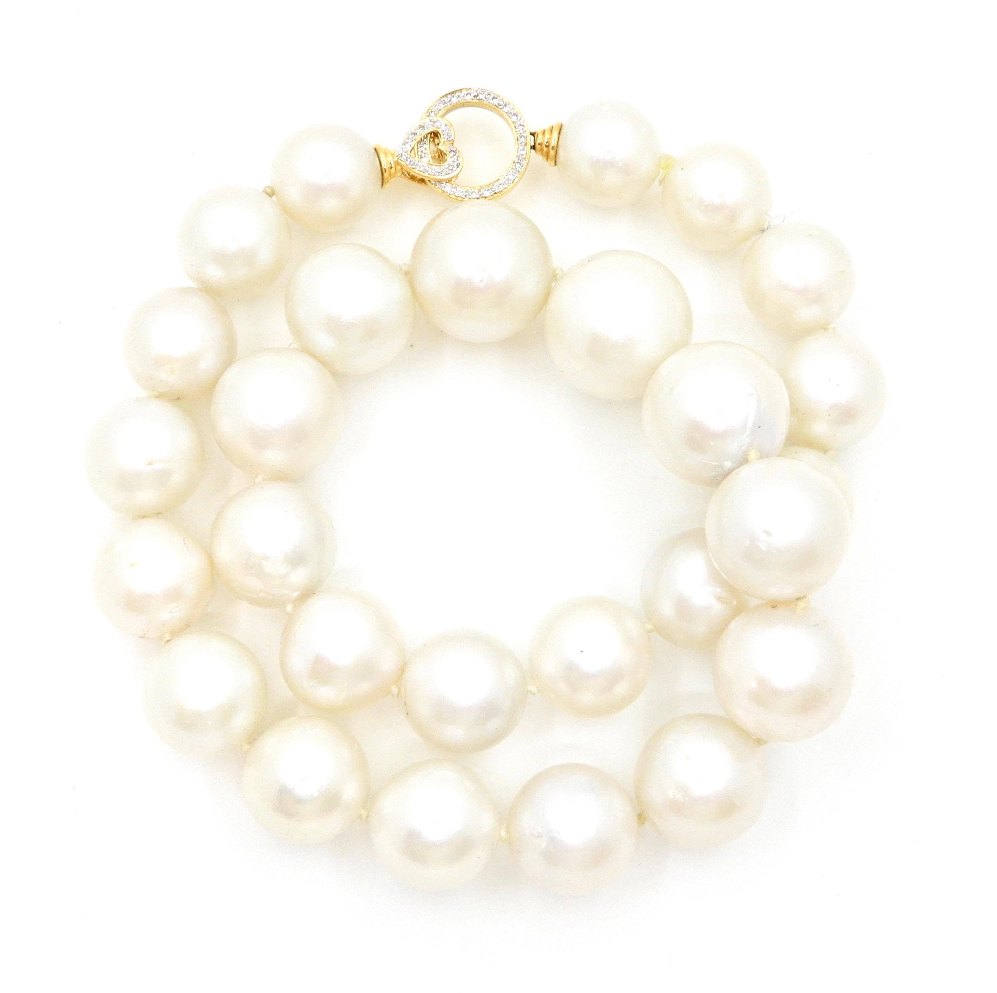 Make this gorgeous 47 cm South Sea Pearl Necklace with 18 Carat Yellow Gold and Diamond Clasp a family heirloom. This beautiful necklace is make of a strand of twenty-seven individually knotted, graduated South Sea pearls and finished with an 18