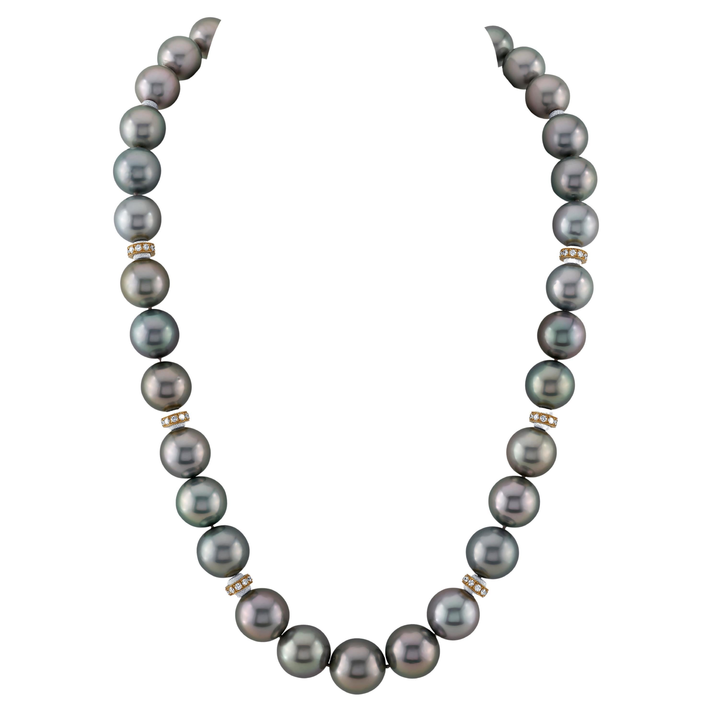 This stunning South Seas pearl necklace features an impressive collection of 33 beautifully matched silver gray pearls with gorgeous luster. The pearls graduate in size from 14.90mm to 11.60mm and are accented with 18k yellow gold, diamond-studded