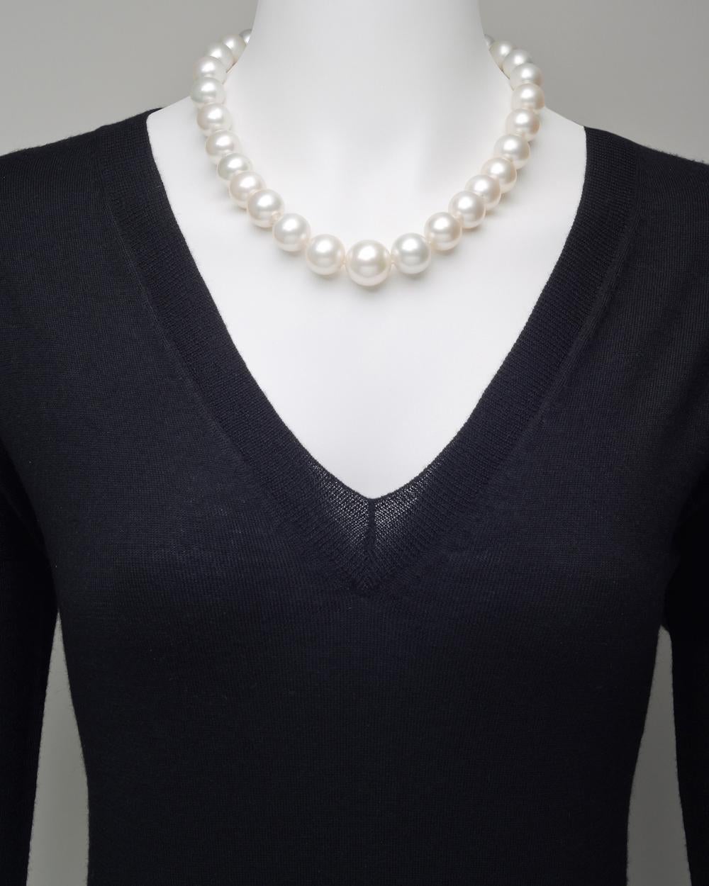 Single strand South Sea pearl necklace, composed of 31 fine South Sea cultured pearls ranging from 18.9 to 13.8mm in diameter, strung on a silk cord and secured by a diamond and platinum ball clasp pavé-set with approximately 6.91 total carats of