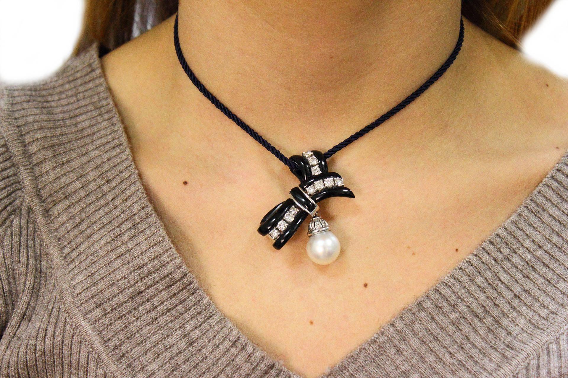 South-Sea Pearl, Onyx, Diamonds, 14 Karat White Gold Ribbon Brooch. For Sale 1