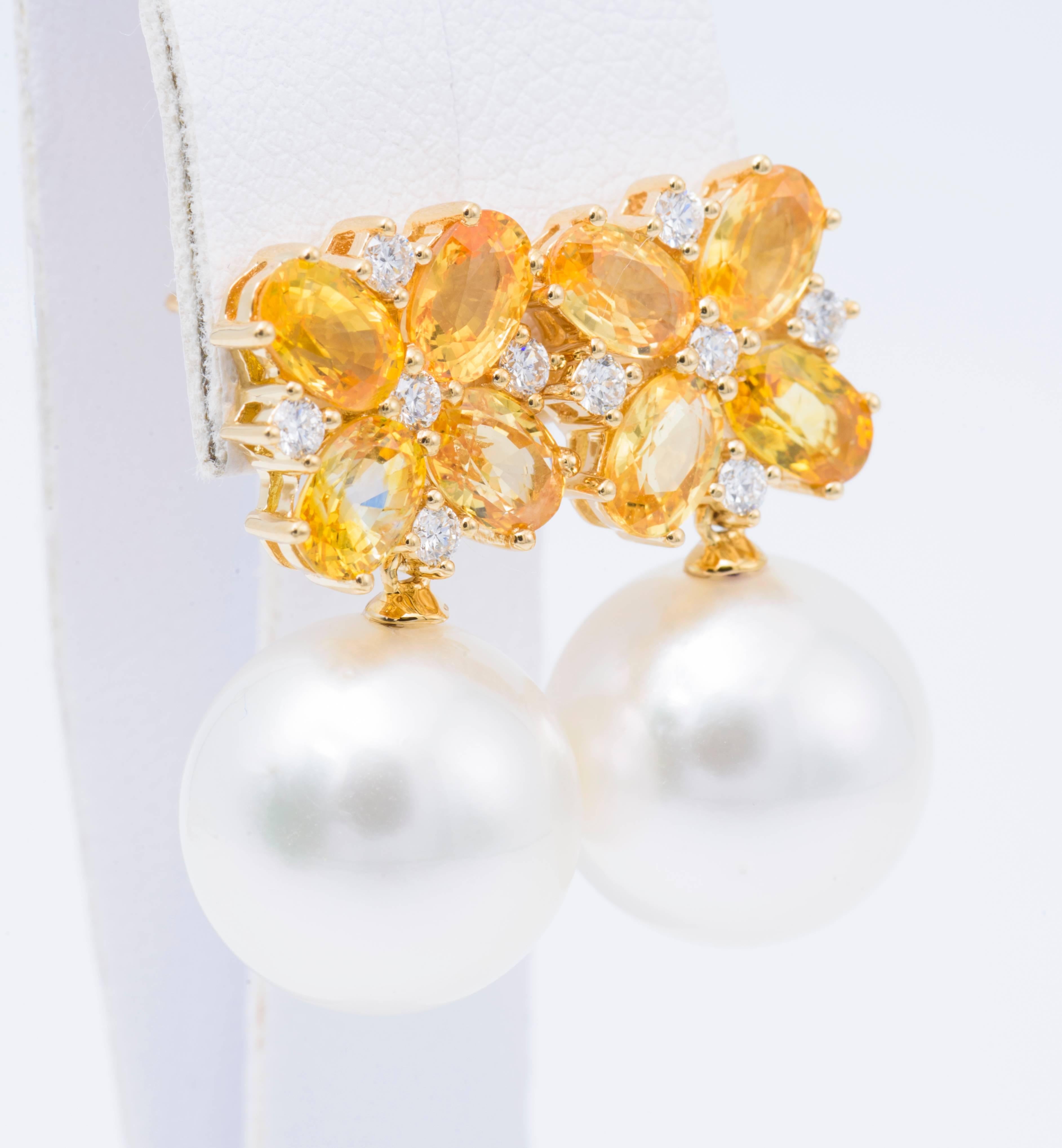 18 K white gold with 13-14 mm South Sea Pearl 
Diamond weight: 0.34 Carats
Sapphire weight: 4.68 Carats
1.3 cm long
