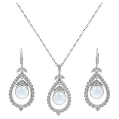 Pendentif et boucles d'oreilles en or blanc 14 carats serti de perles des mers du Sud et diamants