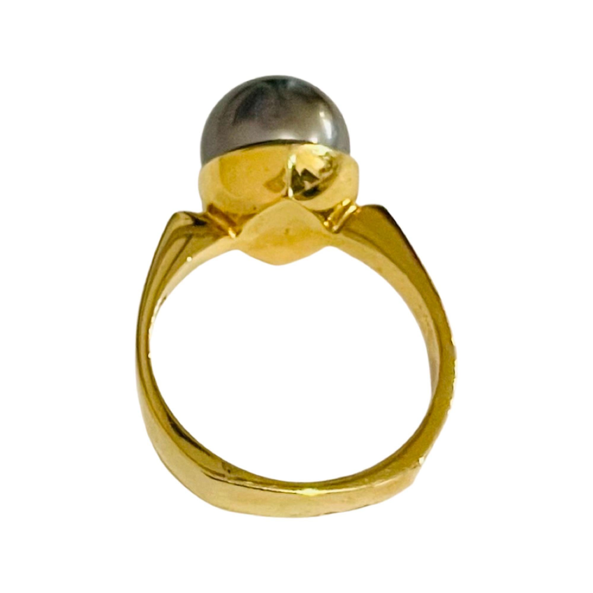 South Sea Pearl 18KY Gold Natural Color Cultured Black Tahitian Pearl Ring. The Pearl is 10.5 mm.  It is round with high luster, rose overtone and very slight blemishes. The shank is 4.3 mm at the top and tapers to 2.5 mm at the base. It is finger