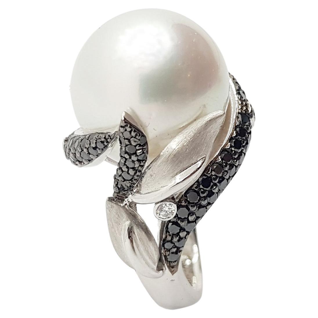 South Sea Pearl with Diamond 0.12 carat and Black Diamond 1.23 carats Ring set in 18 Karat White Gold Settings

Width:  2.0 cm 
Length: 2.0 cm
Ring Size: 51
Total Weight: 20.58 grams

South Sea Pearl:  16.6 mm

