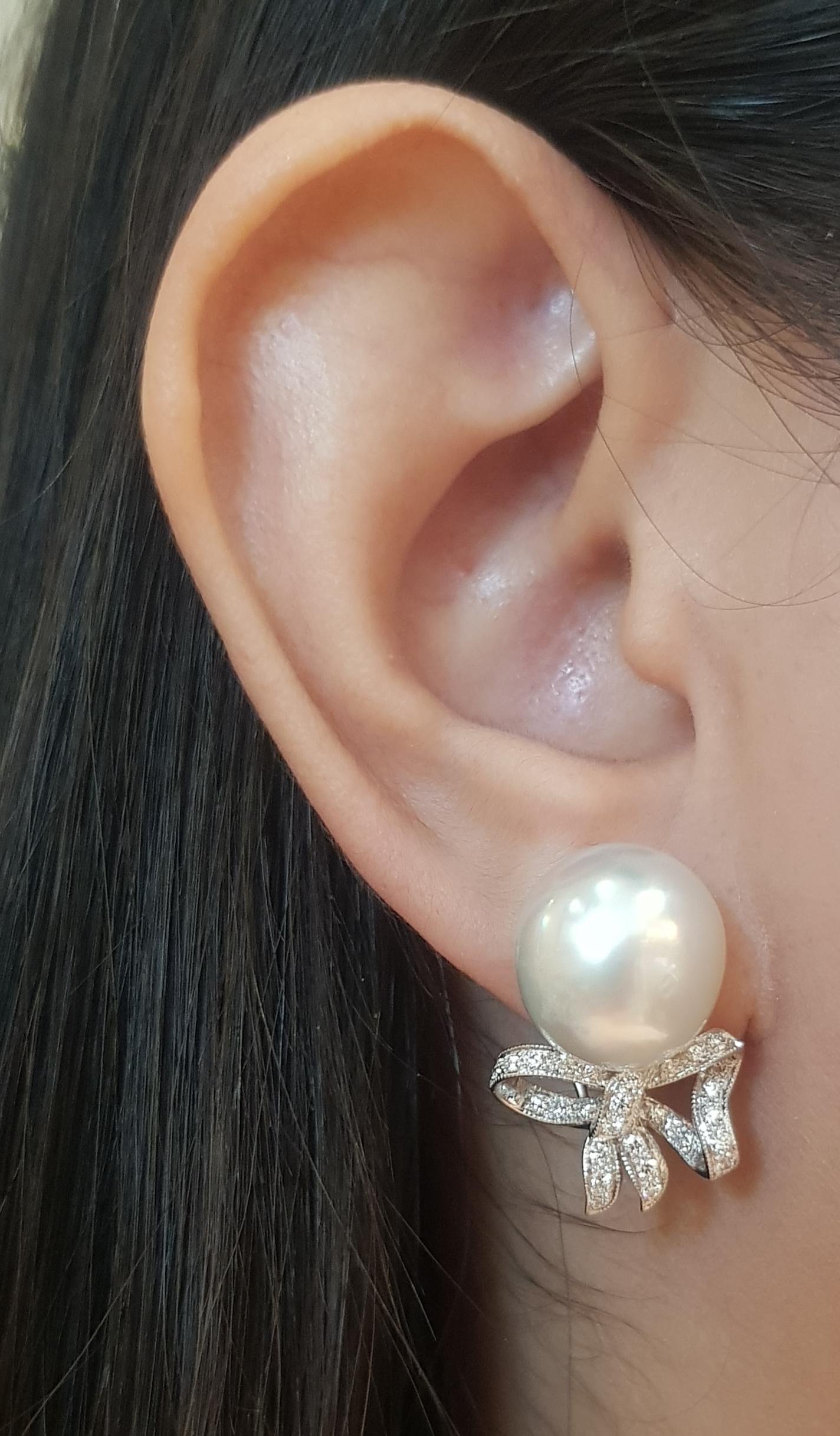 South Sea Pearl with Diamond 0.45 carat Earrings set in 18K White Gold Settings

Width:  1.6 cm 
Length: 2.5 cm
Total Weight: 11.8 grams

South Sea Pearl Approximately: 13 mm


