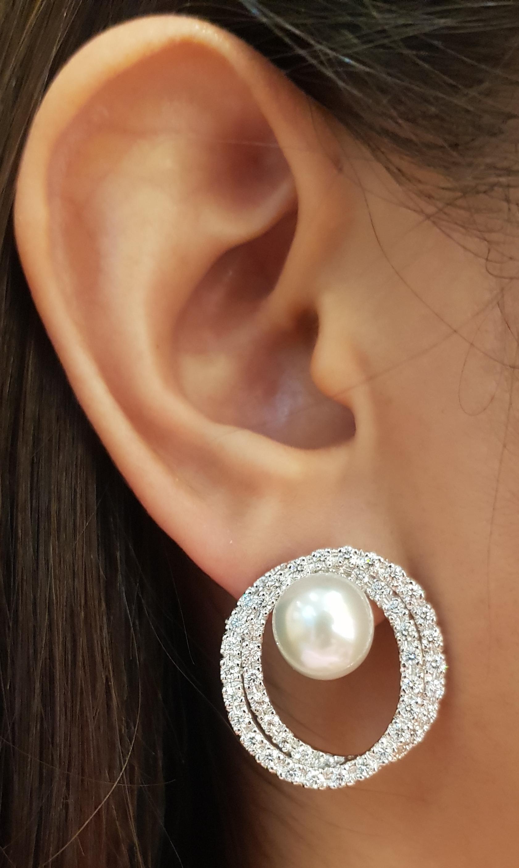 South Sea Pearl with Diamond 2.49 carats Earrings set in 18 Karat White Gold Settings

Width:   2.40 cm 
Length:  2.50 cm
Total Weight: 14.17 grams

South Sea Pearl : 10 mm

