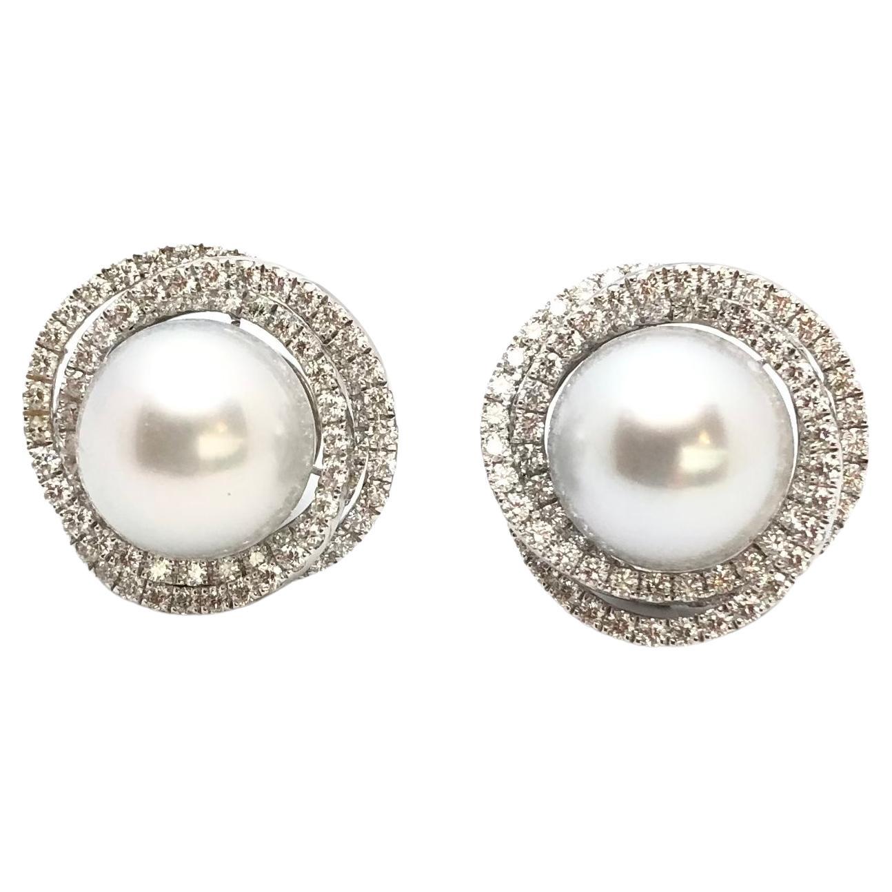 South Sea Pearl with Diamond 2.69 carats Earrings set in 18 Karat White Gold Settings

Width:   2.20 cm 
Length:  2.20 cm
Total Weight: 18.55 grams

South Sea Pearl: 13 mm

