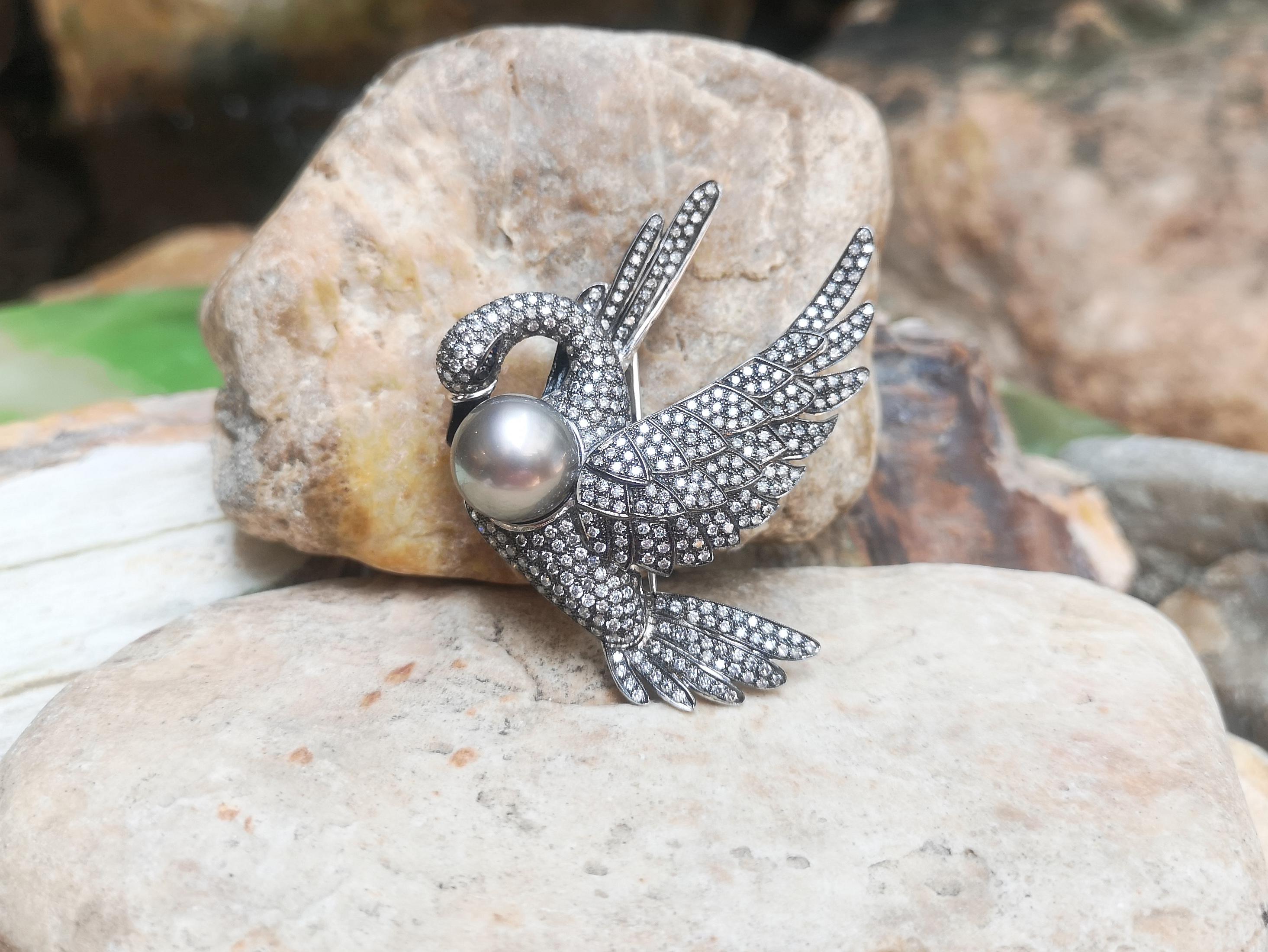 South Sea Pearl with Gray Diamond 5.48 carats and Brown Diamond 0.07 carat Brooch set in 18 Karat White Gold Settings

Width:  6.0 cm 
Length: 6.2 cm
Total Weight: 29.79 grams

