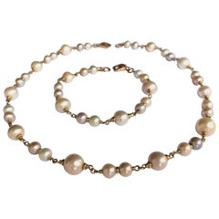 Armband und Halskette aus Südseeperlen und 18 Karat Roségold