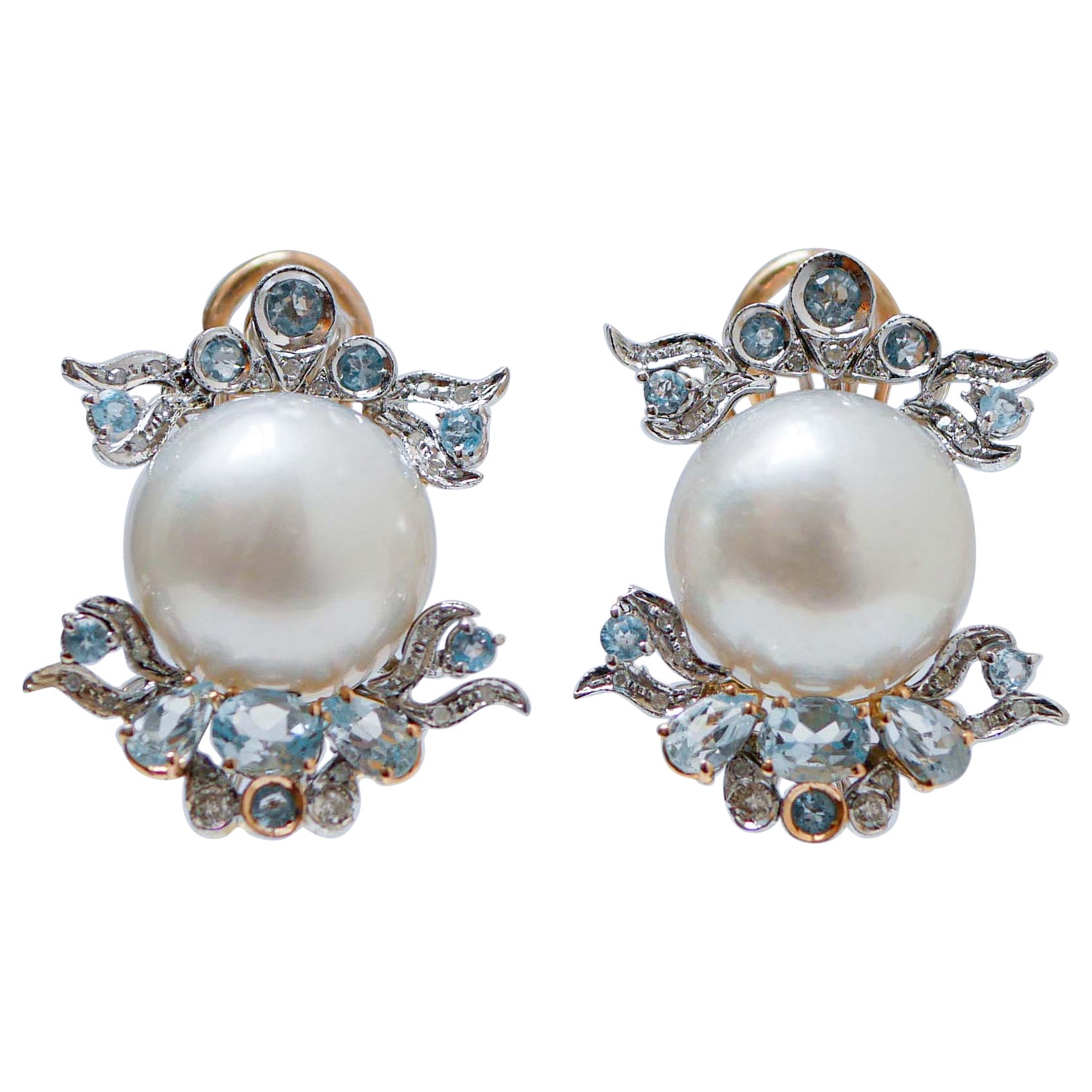 Pendientes de perlas del Mar del Sur, diamantes, topacios color aguamarina y oro de 14 quilates.