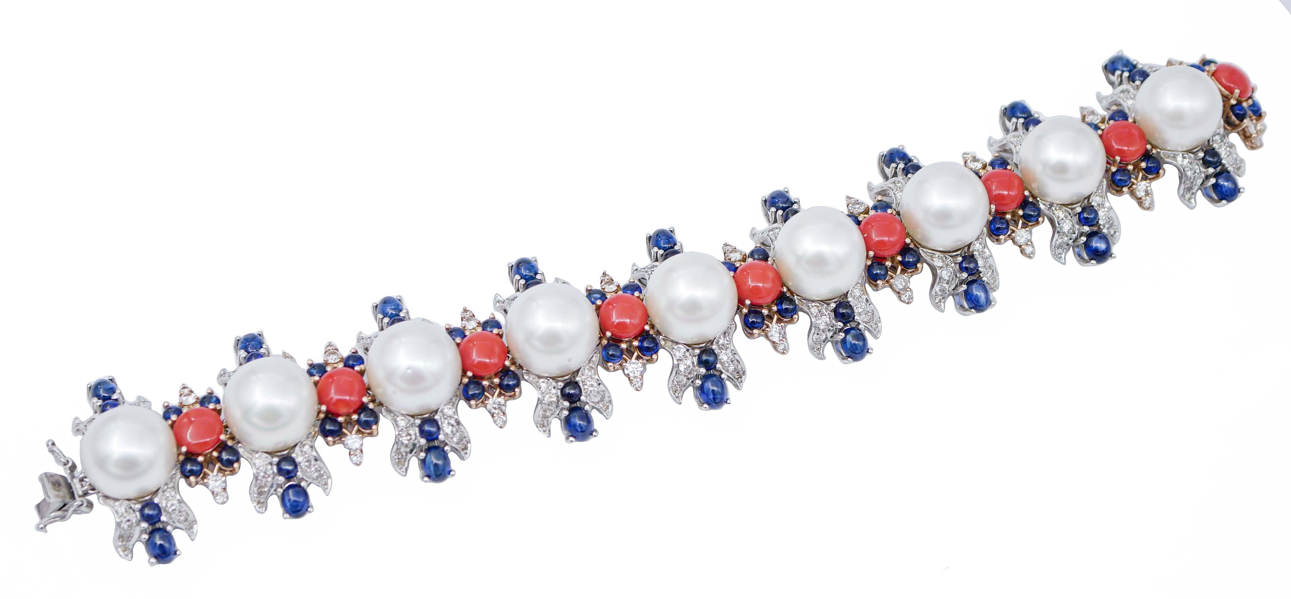 Fantastic retrò bracelet  mounted with 9 section of structures in 14 kt white gold mounted with a south-sea pearl in the central part between diamonds and sapphires. Between every section, a structure in rose gold mounted with a central coral