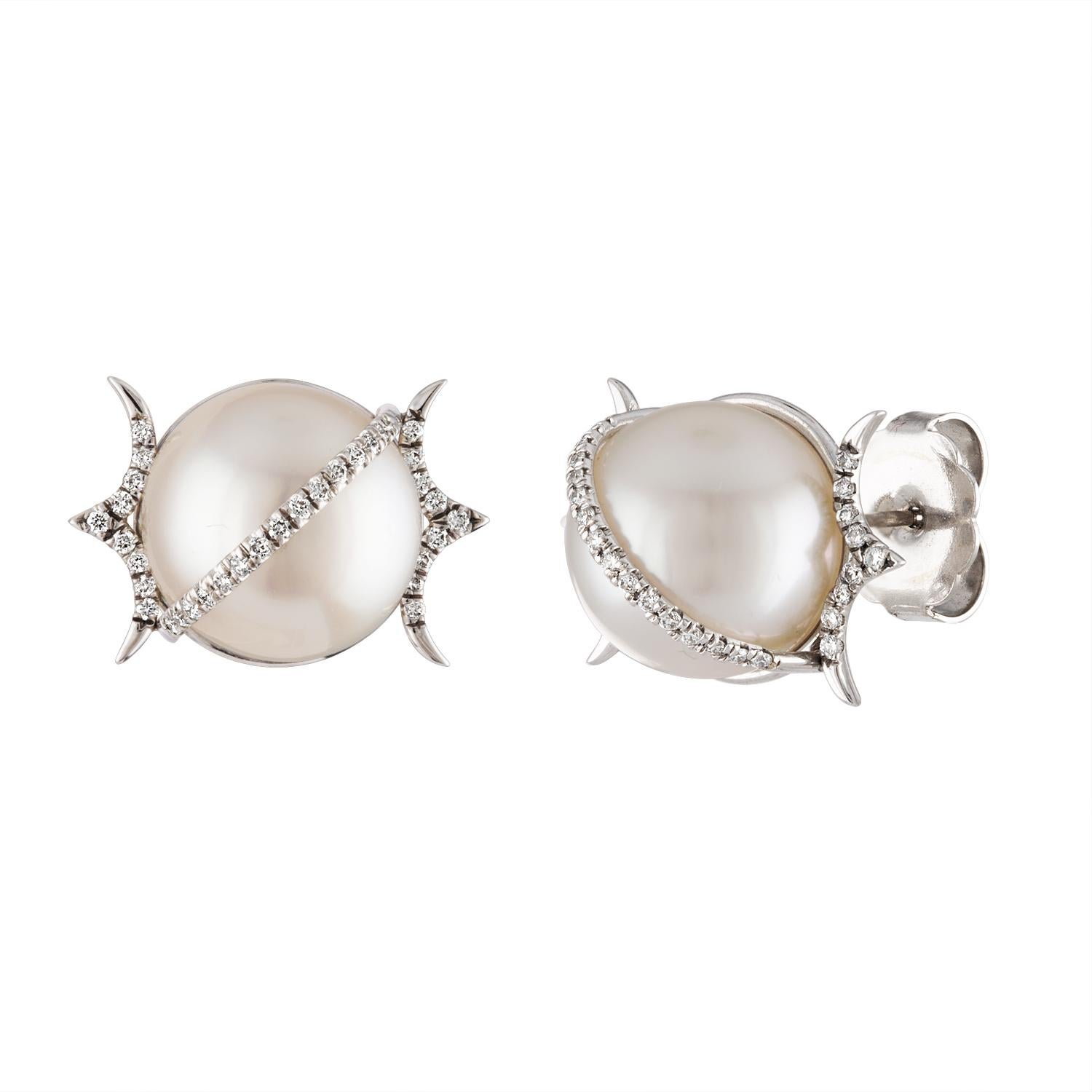 These South Sea Pearl and diamond stud earrings are set in 18K white gold. The pearls measure 12.6mm and the earrings contain 0.34 carats of diamonds. The earrings have secure push back closures. This pair of Australian South Sea pearls feature high