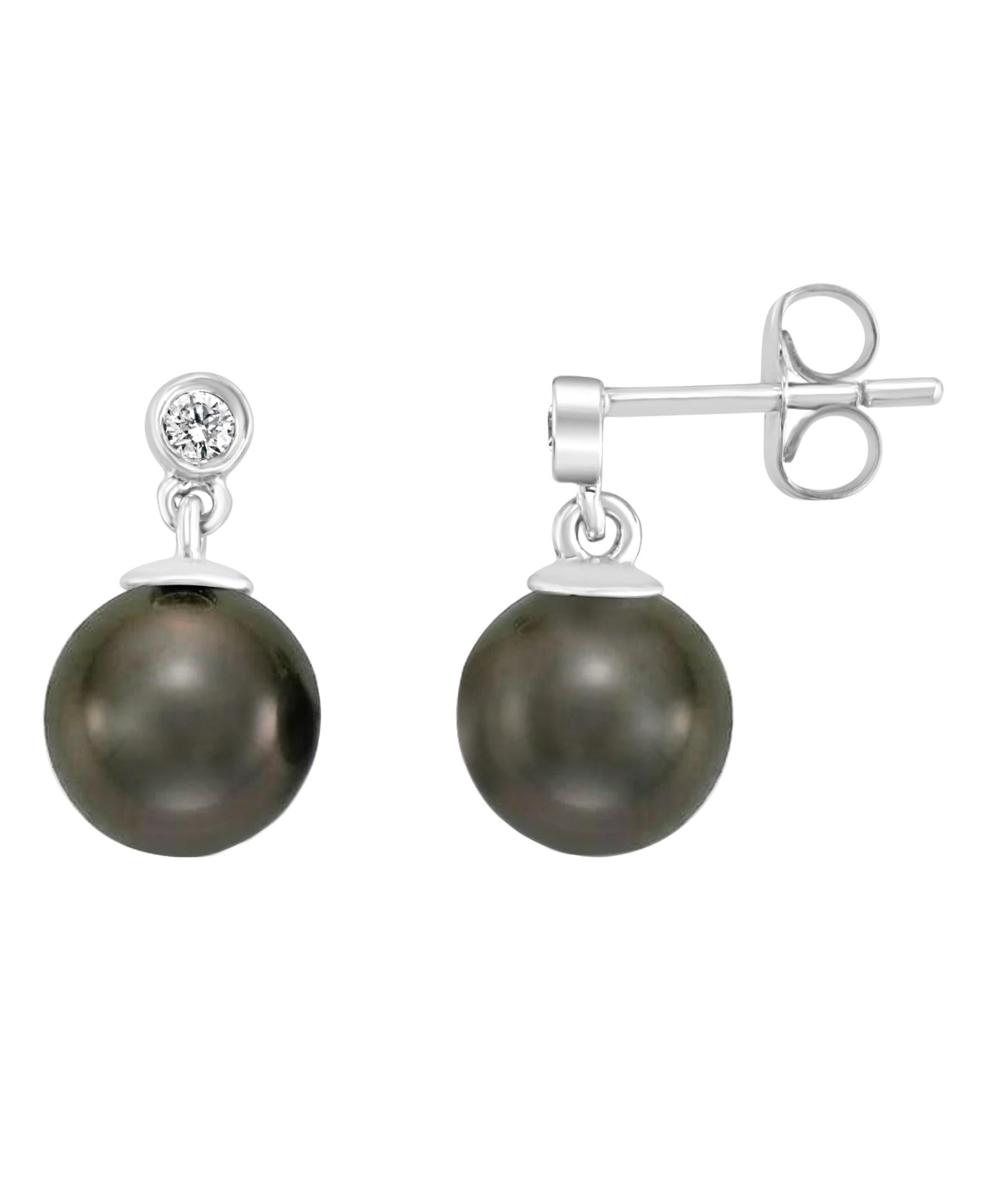 These exquisite 14 karat white gold earrings feature South Sea Tahitian round 7-8mm pearls. The pearls are set beneath 0.06 carats of diamonds. 
Perfect for weddings, anniversaries, birthdays and graduations. Symbolizing purity and transformation,